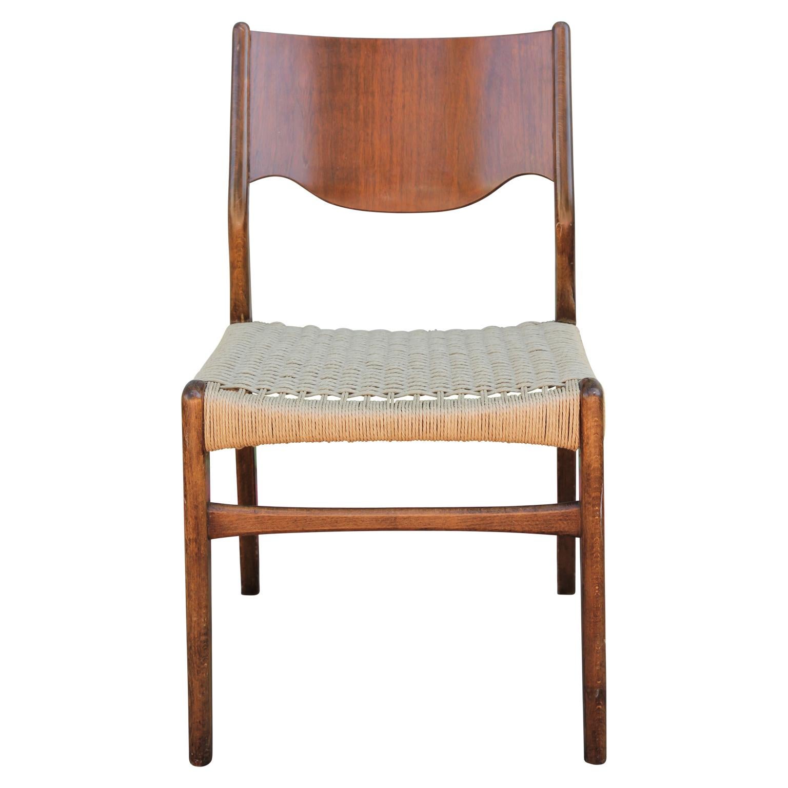 Set of 4 Danish or Swedish wood and woven cord seat dining chairs. The cord seats are freshly done!
  