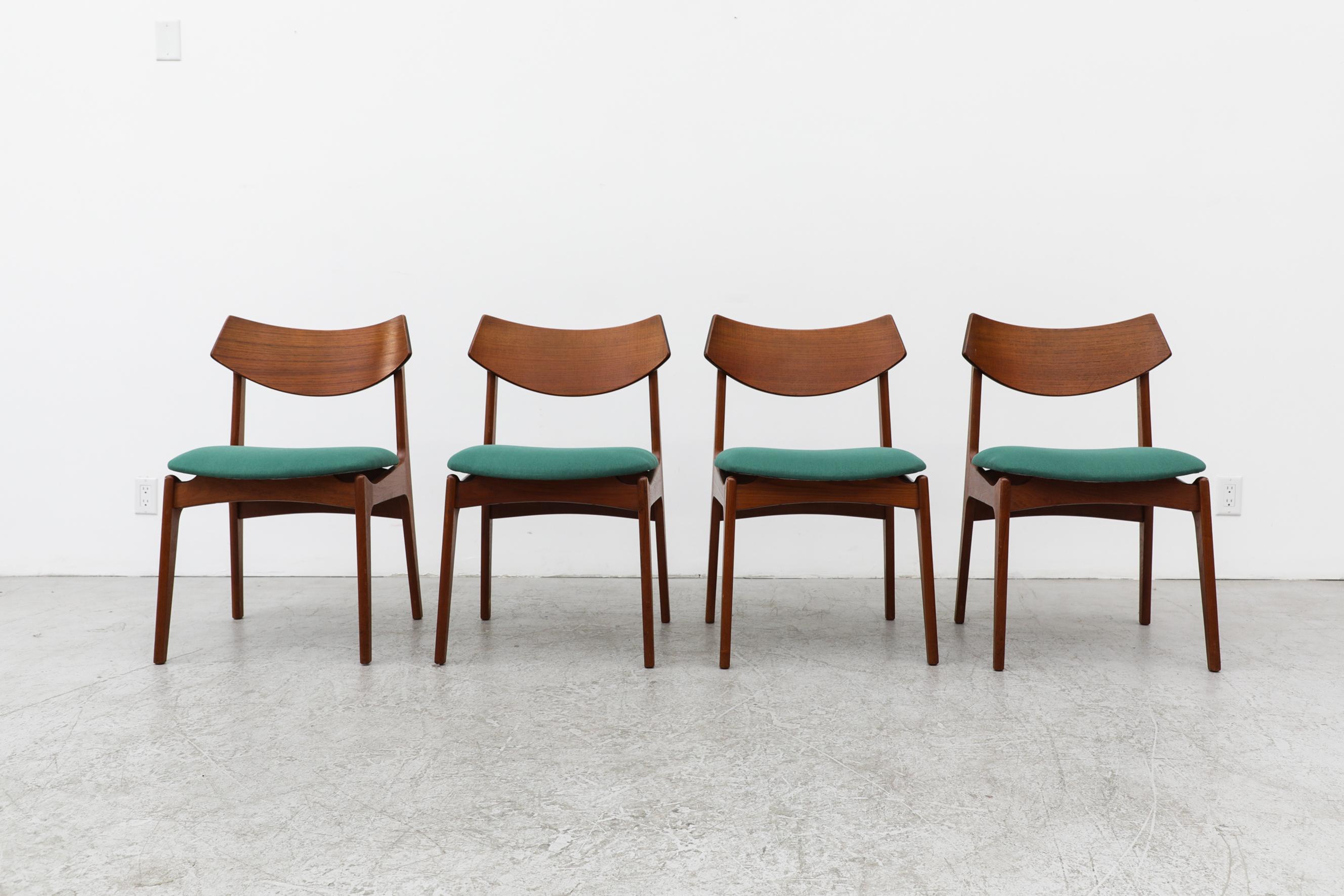 Set of 4 Danish teak dining chairs with teal upholstered seats and smiling backrests. by Funder Schmidt + Madsen. Danish furniture maker Funder-Schmidt & Madsen was highly respected for their excellent quality and superior craftsmanship. These