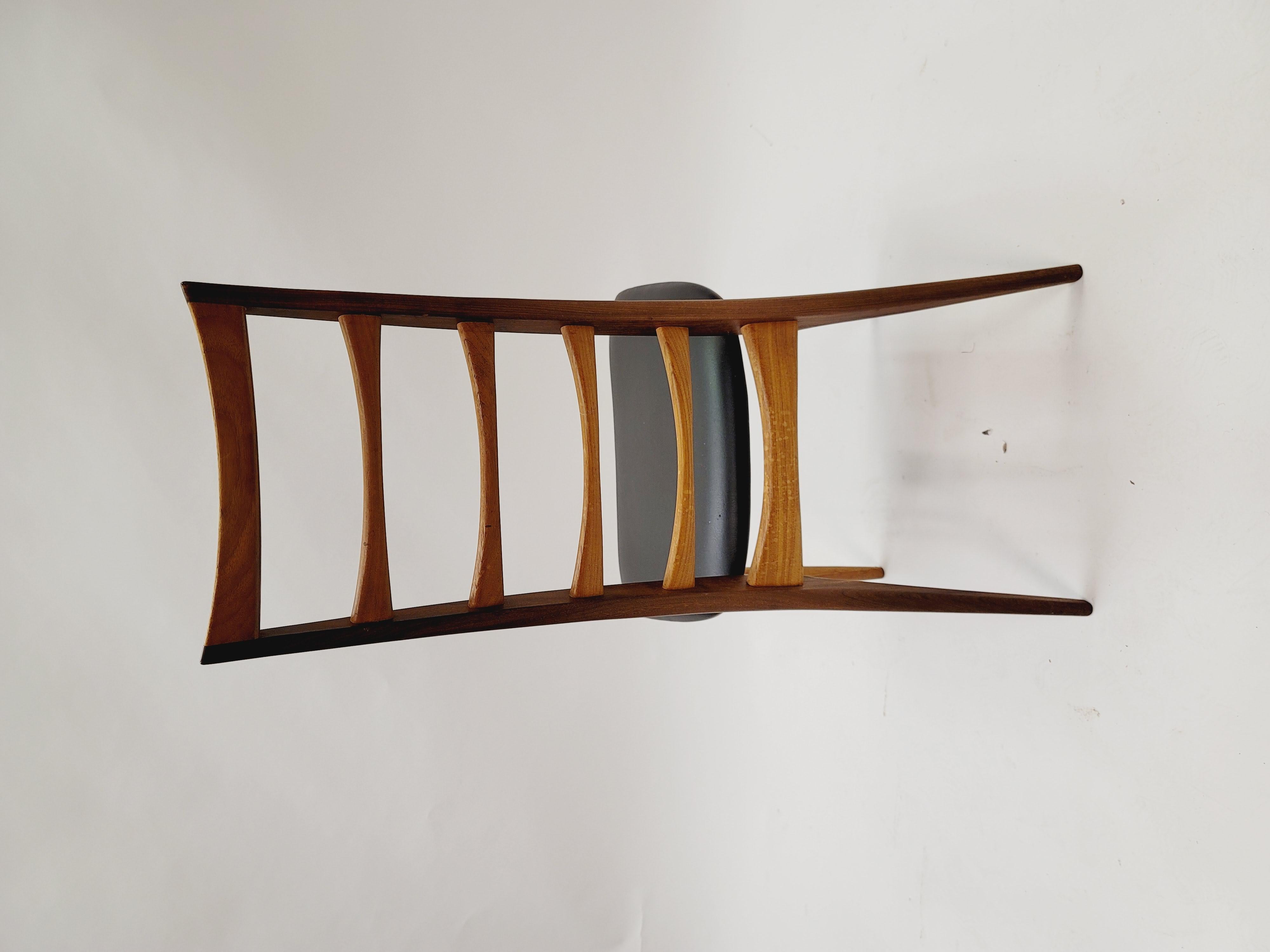 This set of four Danish teak dining chairs with black upholstery were dressings by Neils Koefoed for Koefoeds Hornslet. The chairs are stamped on the underside.