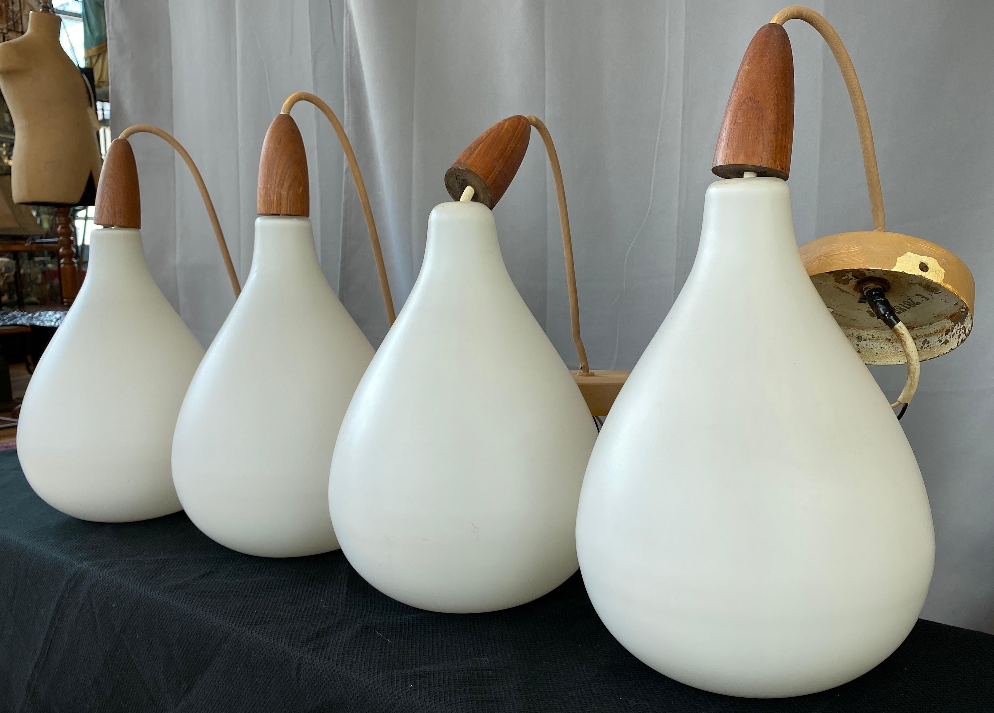 Set of 4 Danish White Cased Glass and Teak Pendants In Good Condition In San Francisco, CA
