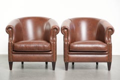 Ensemble de 4 fauteuils club en cuir de vachette de couleur cognac foncé de style anglais