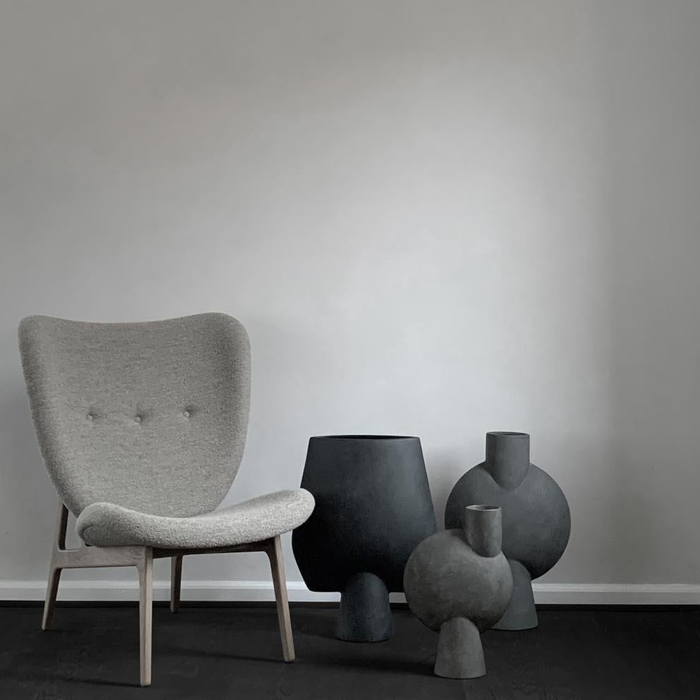 Set of 4 dark grey big sphere vases Bubl by 101 Copenhagen
Designed by Kristian Sofus Hansen & Tommy Hyldahl
Dimensions: L 31,5 / W 14 / H 45 cm
Materials: ceramic

The Sphere collection celebrates unique silhouettes and textures that makes an