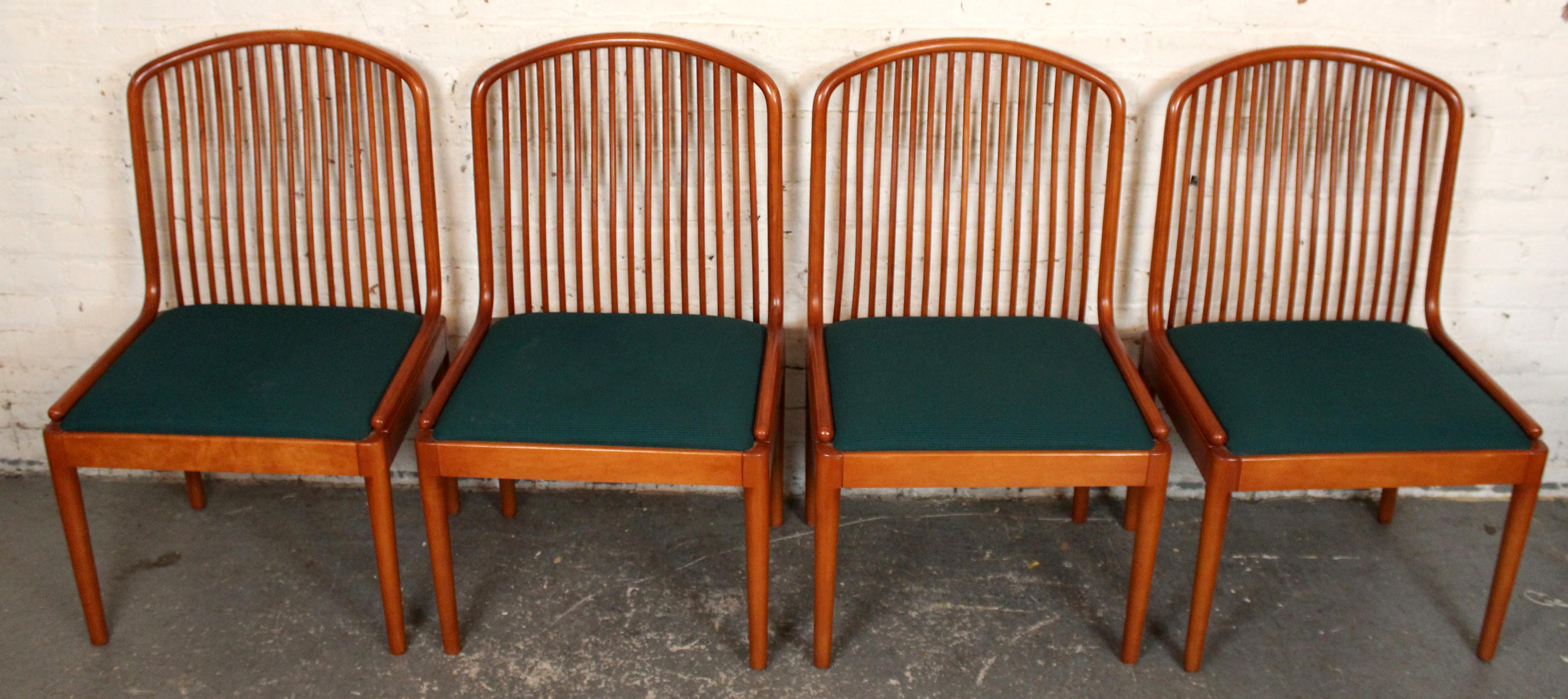 Refined and minimalist, this set of four “Exeter” chairs — designed by Davis Allen for Knoll — blends functional design with quiet elegance. Each chair features a solid wood frame (typically beech) with a refined finish, supporting a