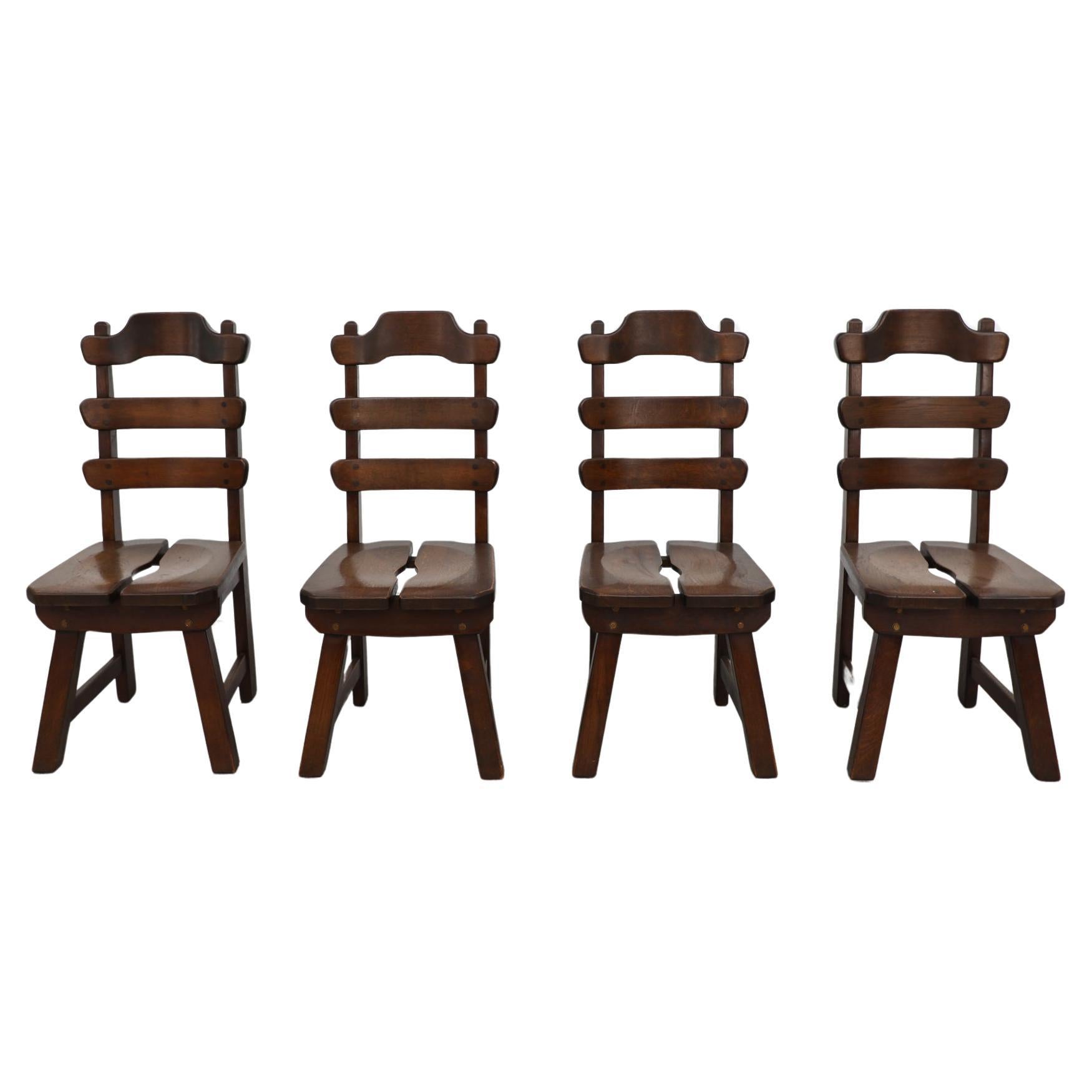 De Puydt (attr) ensemble de 4 chaises brutalistes à dossier en échelle en chêne teinté foncé en vente