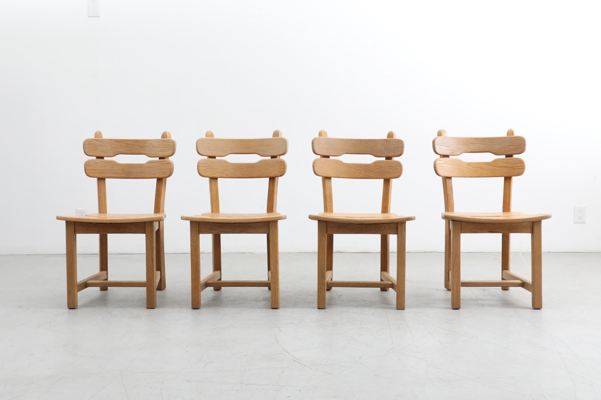 Set of 4 Brutalist Belgian light oak dining chairs with slatted seats and backrests. In good condition with some wear consistent with their age and use. Other similar seating is available and listed separately (LU922432022122).