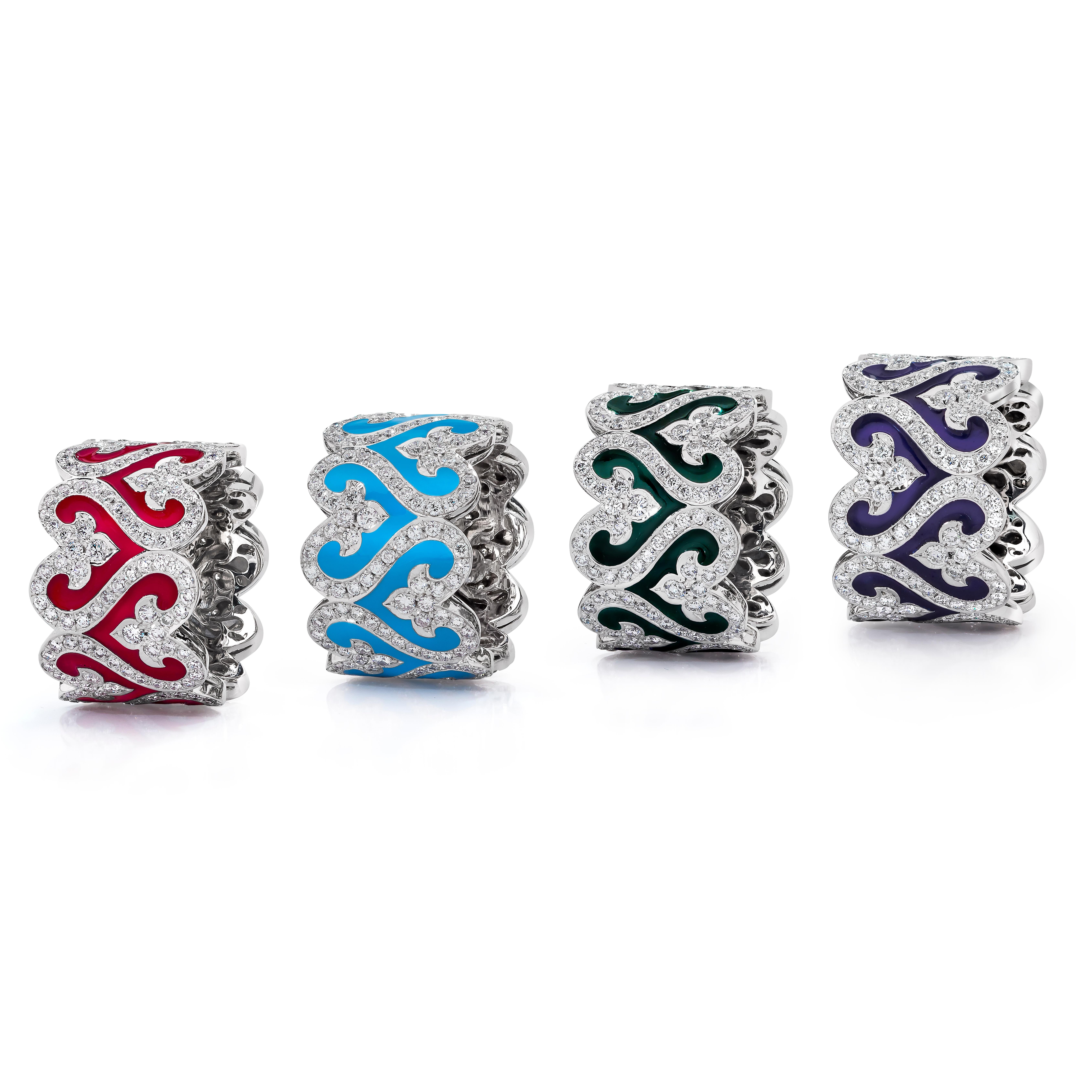 Enamel and Diamond Wide Band Rings

Each Ring consists of 220 Round Brilliant Diamonds weighing 2.44 Carats Set in 18 Karat White Gold.

Emerald, Ruby, Sapphire and Turquoise colored Enamel.