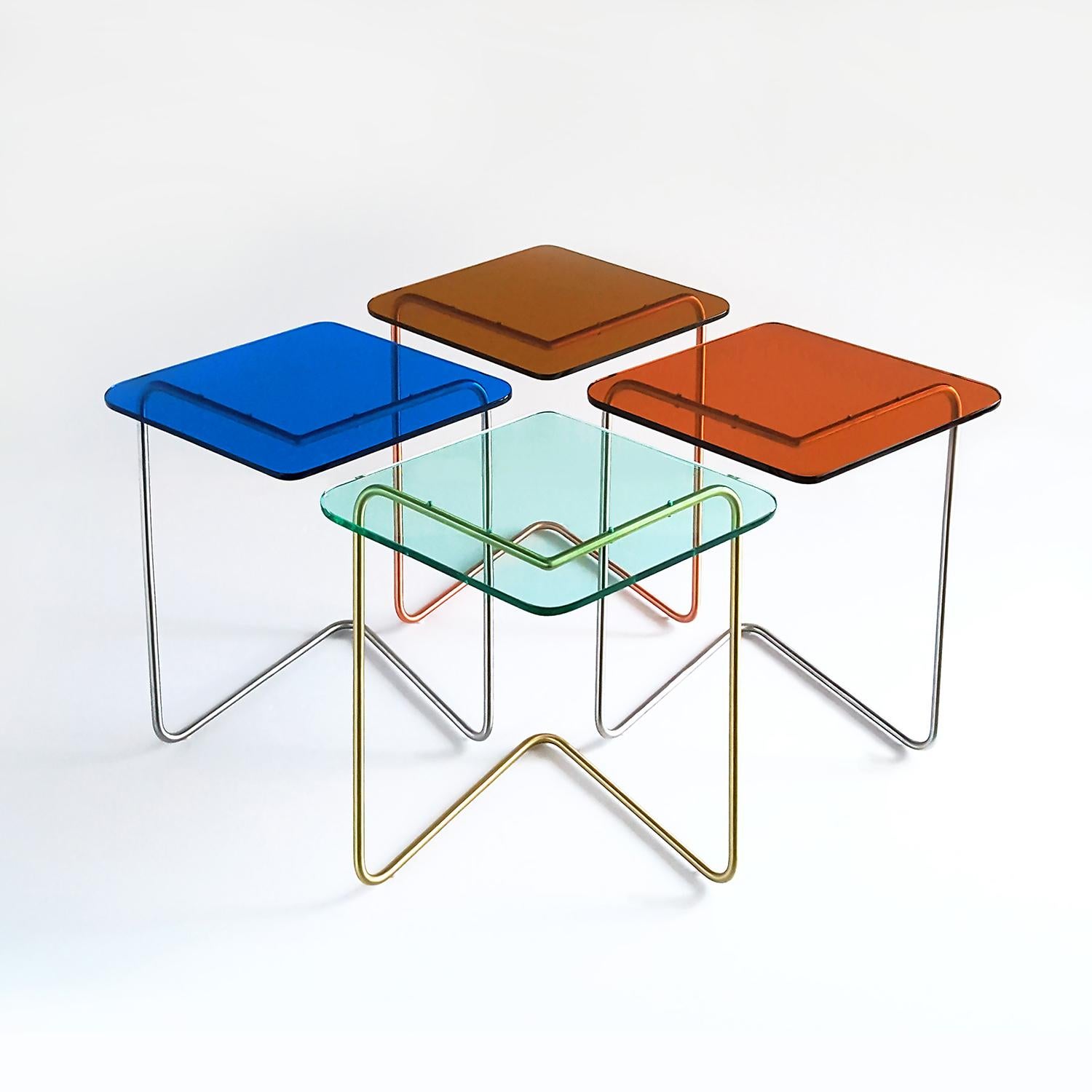 The Diamond side table by Rita Kettaneh. 
Dimensions: The base: brushed stainless steel. 
 optionally plated with copper or brass.
 The top: acrylic.
Materials: H 42 x W 45 x D 34.5 cm.
Weight: 2.65 Kg.

Colors and Finishes: 
Stainless