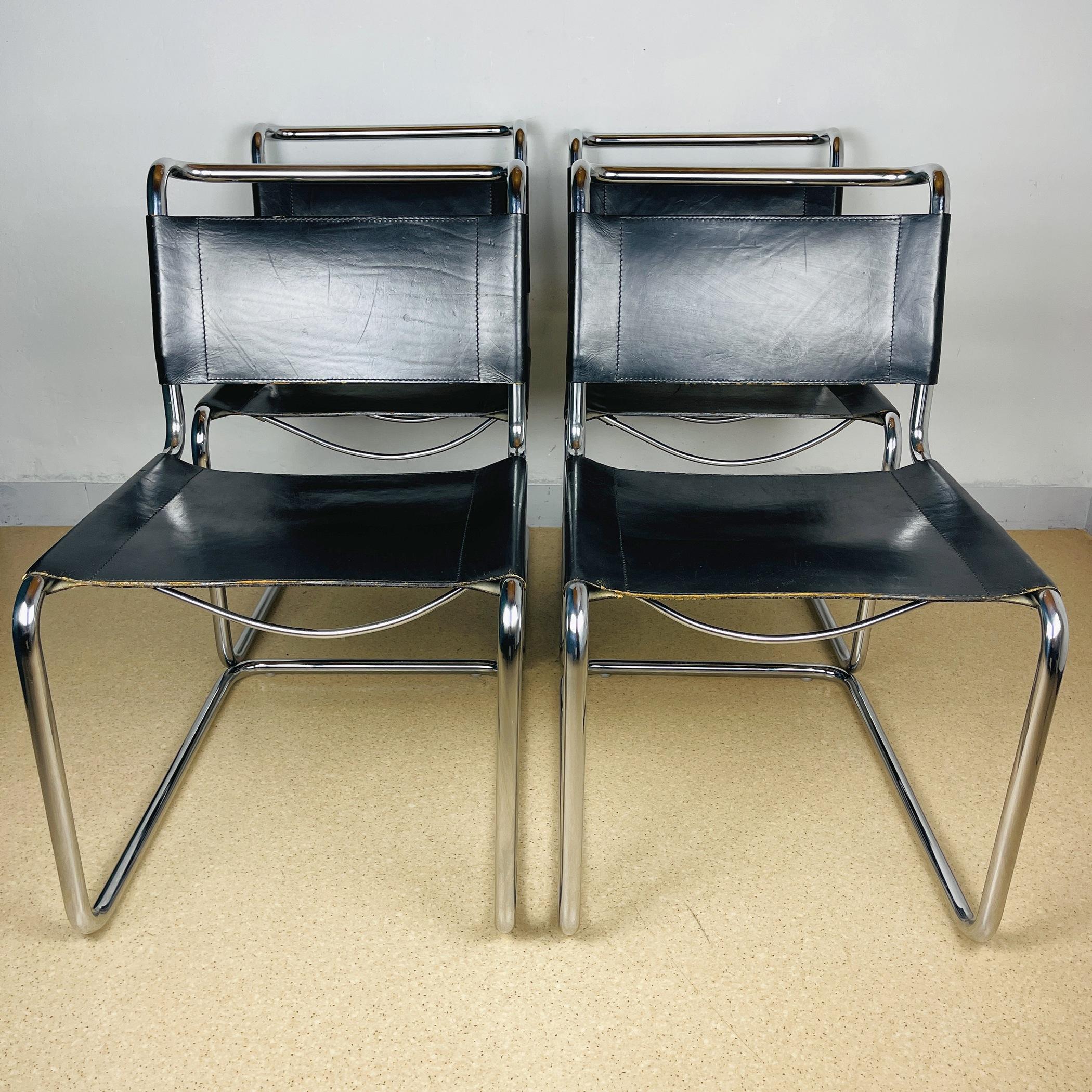 The set of 4 dining chairs B33 was made in Italy in the 1970s. Chairs designed by Marcel Breuer in 1928. The chairs feature original thick, soft black cowhide leather and elegant, flowing tubular chrome frames. Good vintage condition. Chrome is in