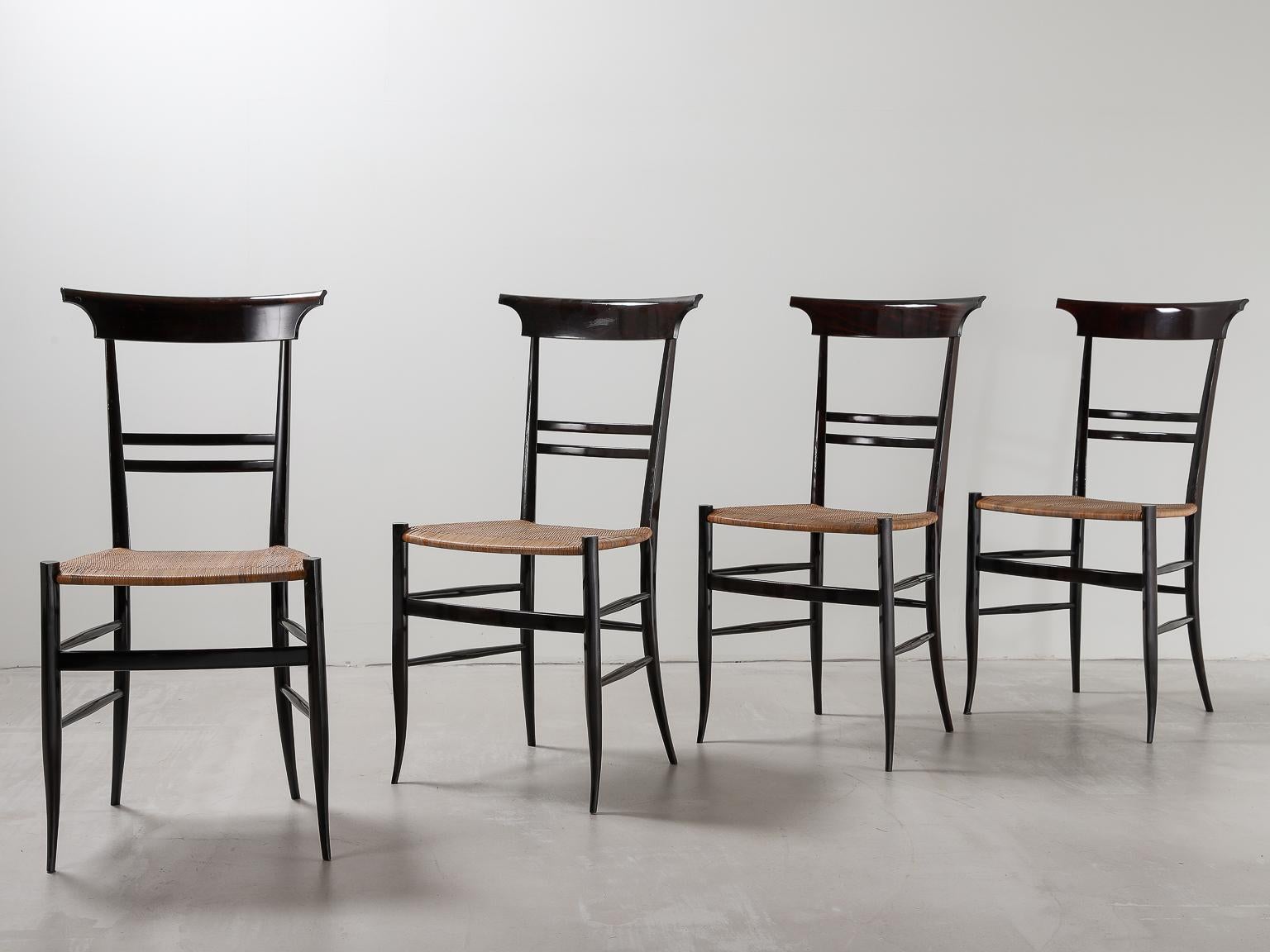 Set of 4 dining chairs, black frame and cane seat in the style of Gio Ponti.