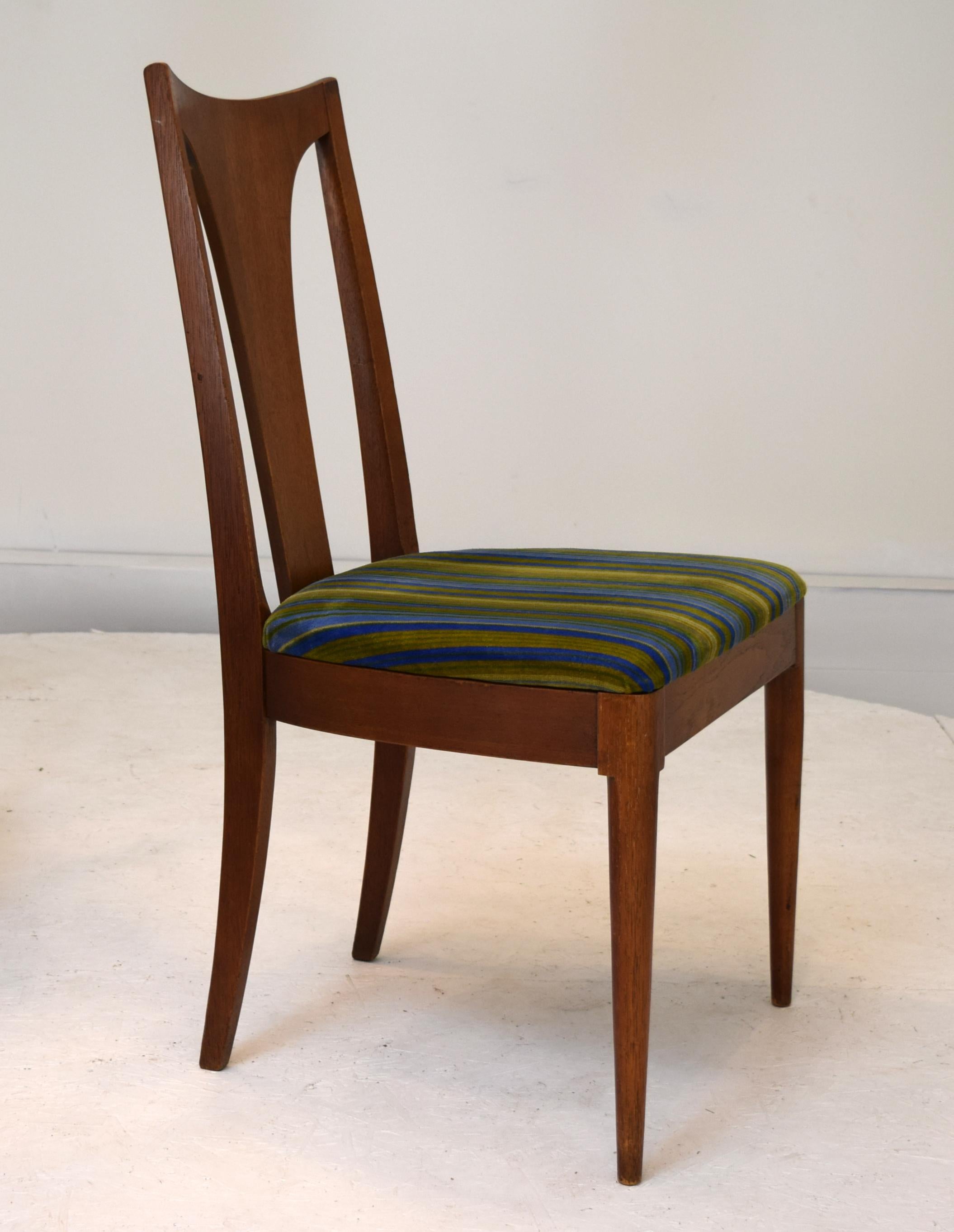 Saga Series by Broyhill circa 1956, set of 4 dining chairs with original upholstery. Walnut, birch. Mild marks to frames, entirely sturdy and no repairs. Upholstery could benefit from replacement. Measures 18.5