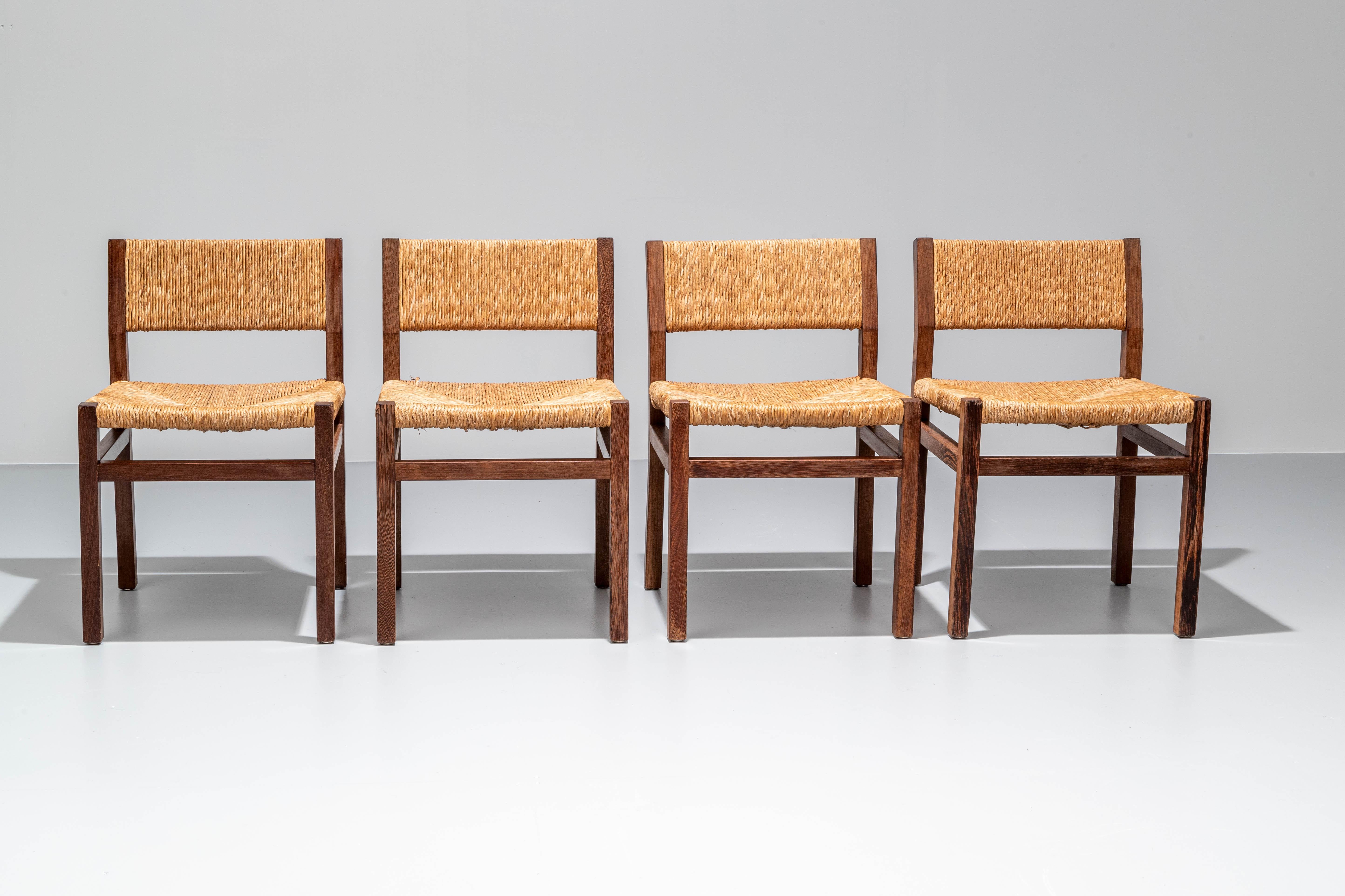 Set of 4 dining chairs by Martin Visser for 'T Spectrum in Wengé hardwood. 

Rectangular and square shapes of mixed luxurious organic material, that's what comes to mind if you look at these chairs. The darker wengé works very well with the ligher