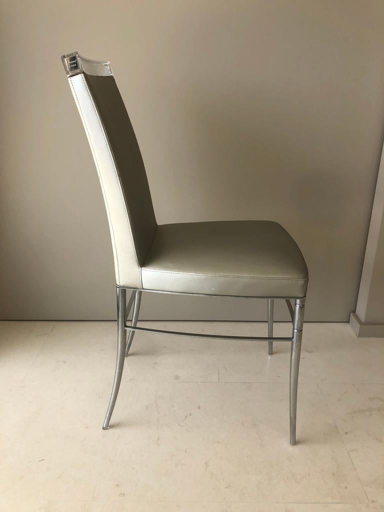 Very rare for sale, set of four dining chairs designed by Philippe Starck for Baccarat from their Crystal Dream collection - France 2009.
Structure in polished steel
Baccarat clear crystal barrette
Metallic gray Kvadrat coating