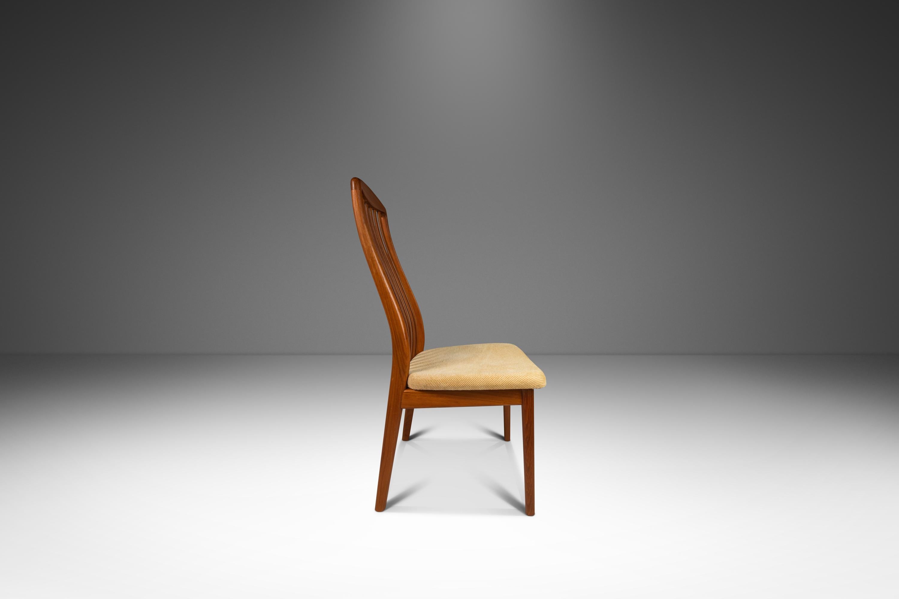 Introducing an absolutely arresting set of dining chairs designed by Preben Schou Andersen for Schou Andersen Møbelfabrik, crafted in the 1970s in Denmark. This stunning set is constructed from solid teak hardwood, showcasing the natural beauty of