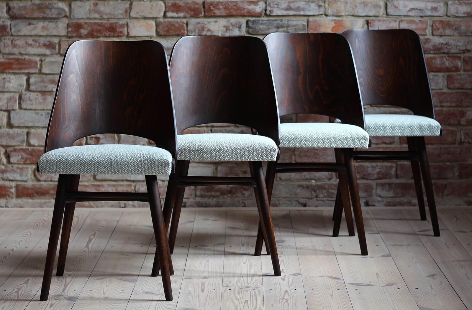 This set of four vintage dining chairs was designed by Czech designer Radomir Hofman in the 1960s. Produced by TON. The chairs have been completely restored finished with natural oil that gave them a natural and warm look. The set is reupholstered