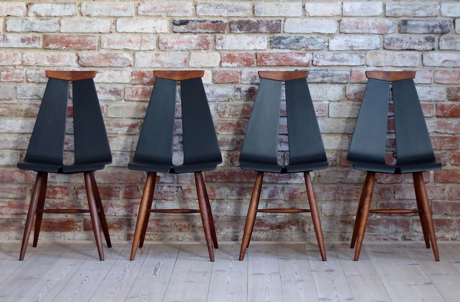 This set of four vintage dining chairs was designed by Risto Halme in the 1960s. Produced by Isku Finland. These original Isku chairs are simple and light but have an elegant and playful design. The curved wood on the back presents two slats which