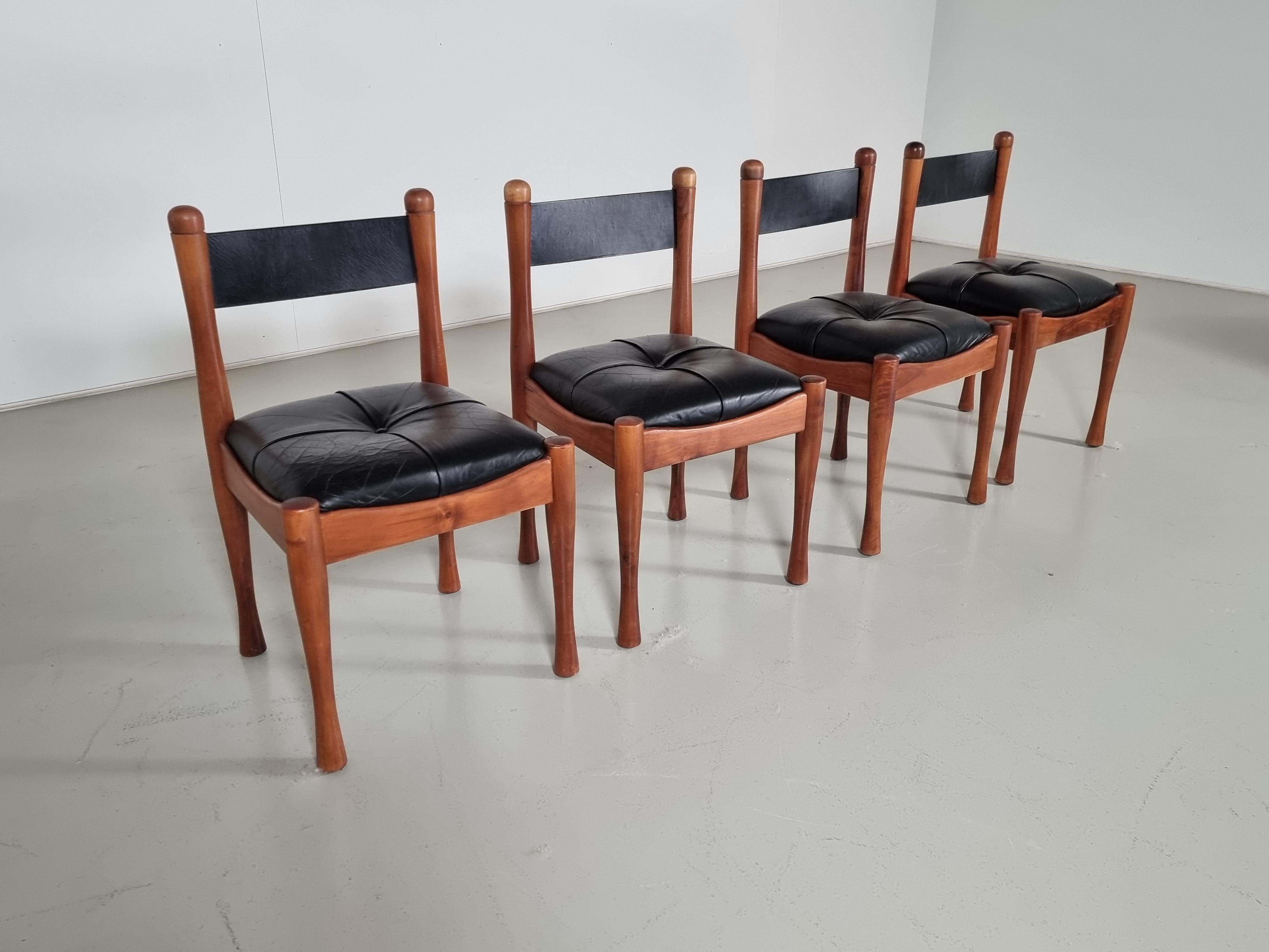 Silvio Coppola for Bernini, set of 6 dining chairs, stained wood, black leather, Italy, 1960s

This set of chairs was designed by Silvio Coppola for Bernini in the 1960s. These chairs feature a characteristic darkened frame and upholstered black