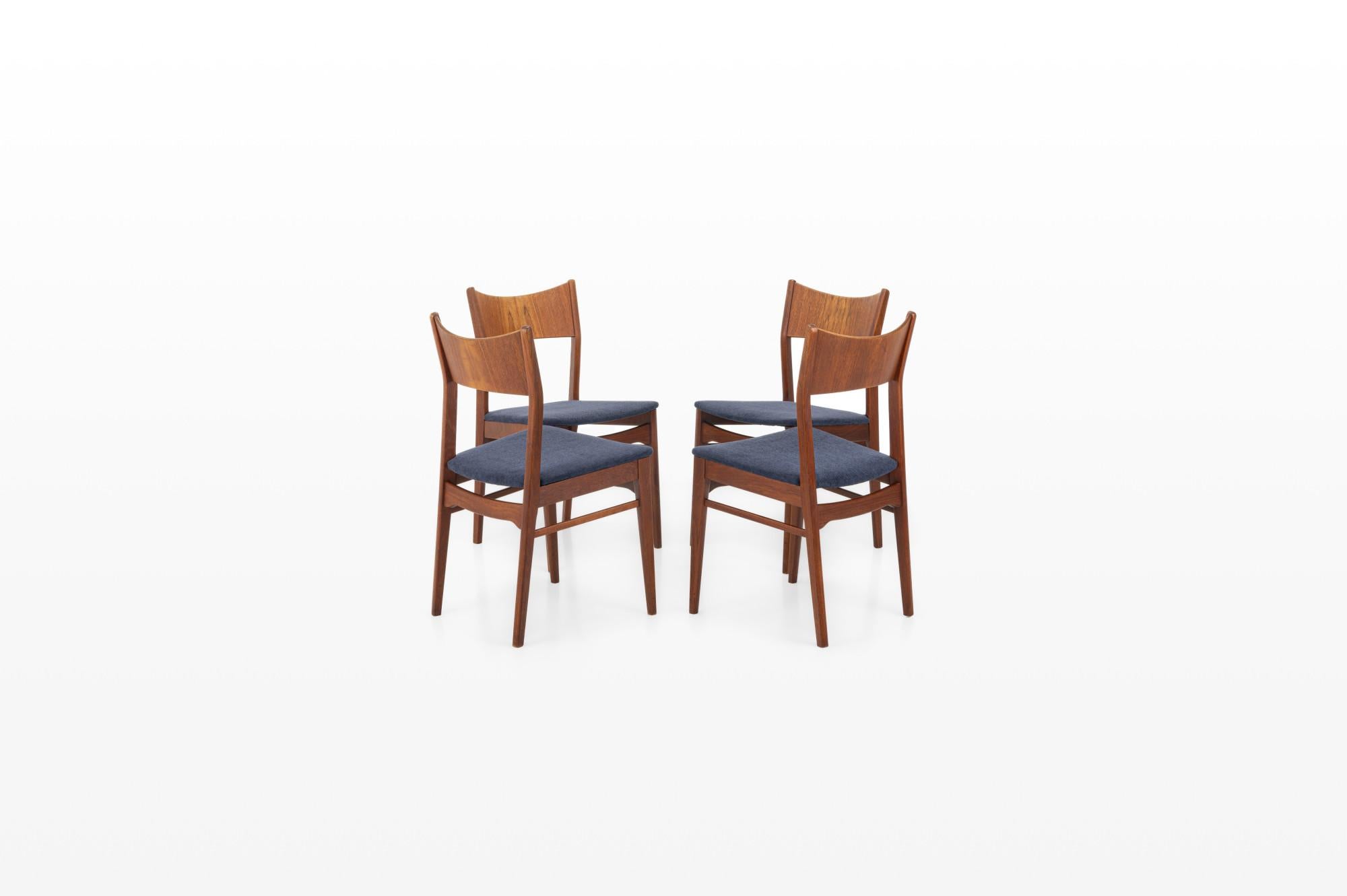 Set of four vintage dining chairs in teak, manufactured by Sorø Stolefabrik in Denmark in the 1960s. The chairs have a teak frame and are reupholstered with a dark blue fabric.

