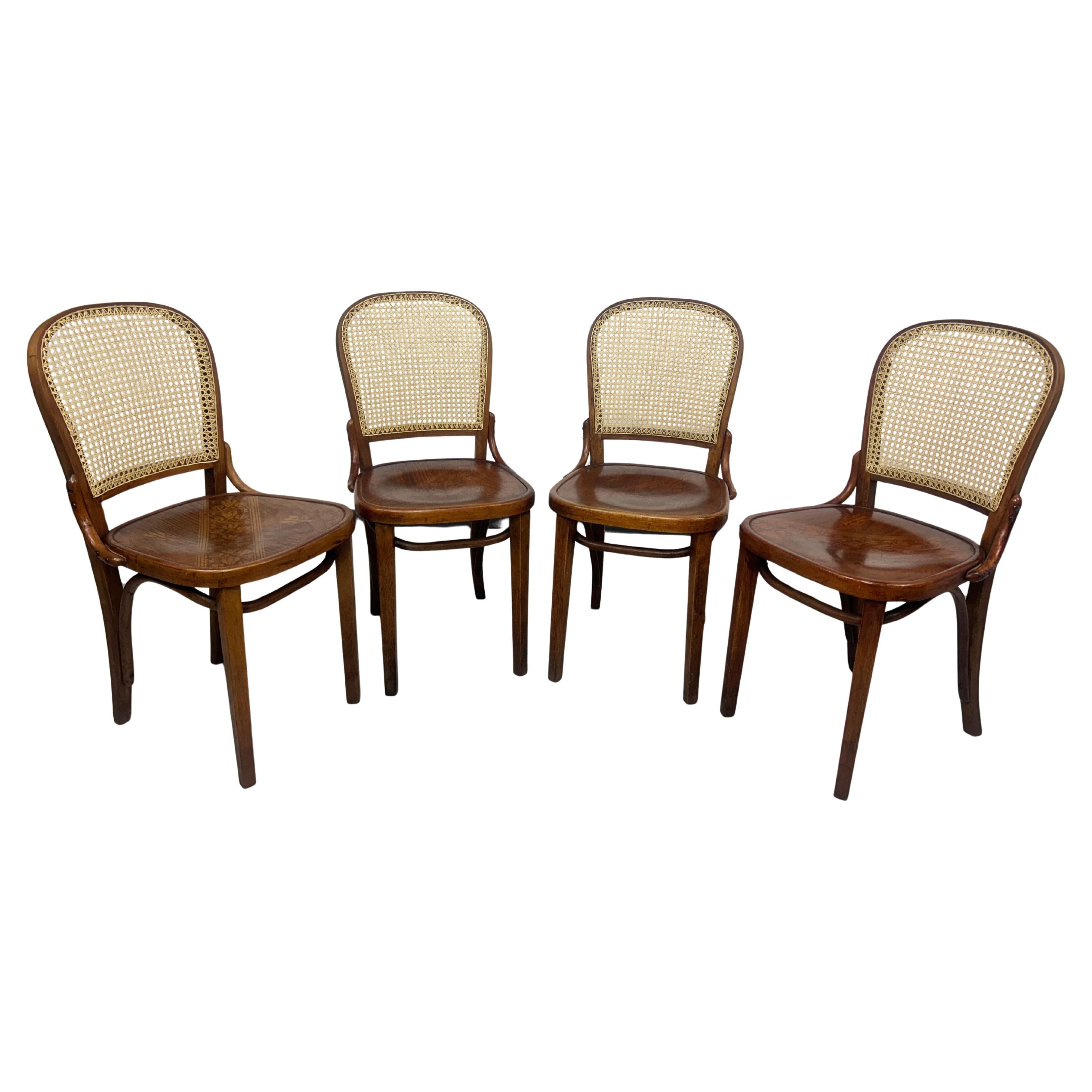 Set of 4 dining chairs by Thonet