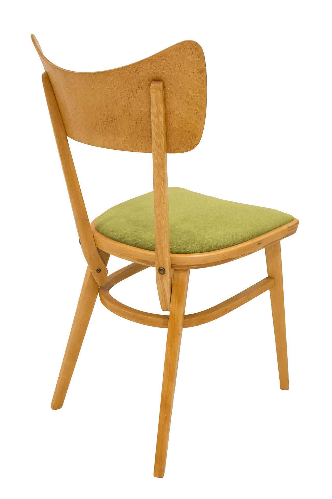 This set of four chairs was made in Czechoslovakia in the 1960s. The frame of the chair was made of beechwood, the profiled backrest of the chair was made of bent plywood and overall it is a very solid construction. The wooden elements underwent a