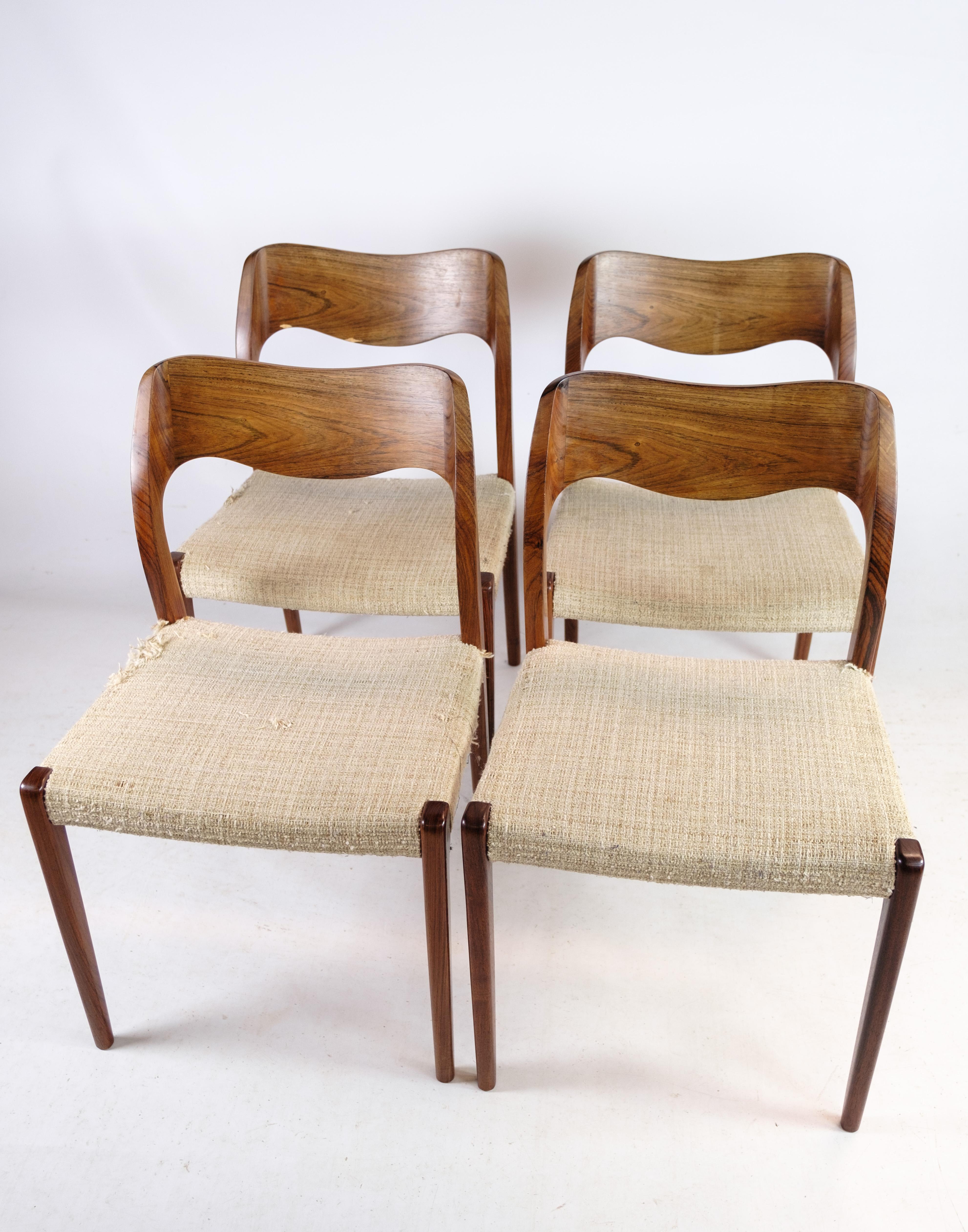 Set of 4 dining room chairs, model 71, designed by N.O Møller designed in 1951. Stands with very fine rosewood frame, and wicker seat. Produced by J.L. Møllers Møbelfabrik.
Dimensions in cm: H: 77.5 W: 50 D: 42 SH: 45

This product will be