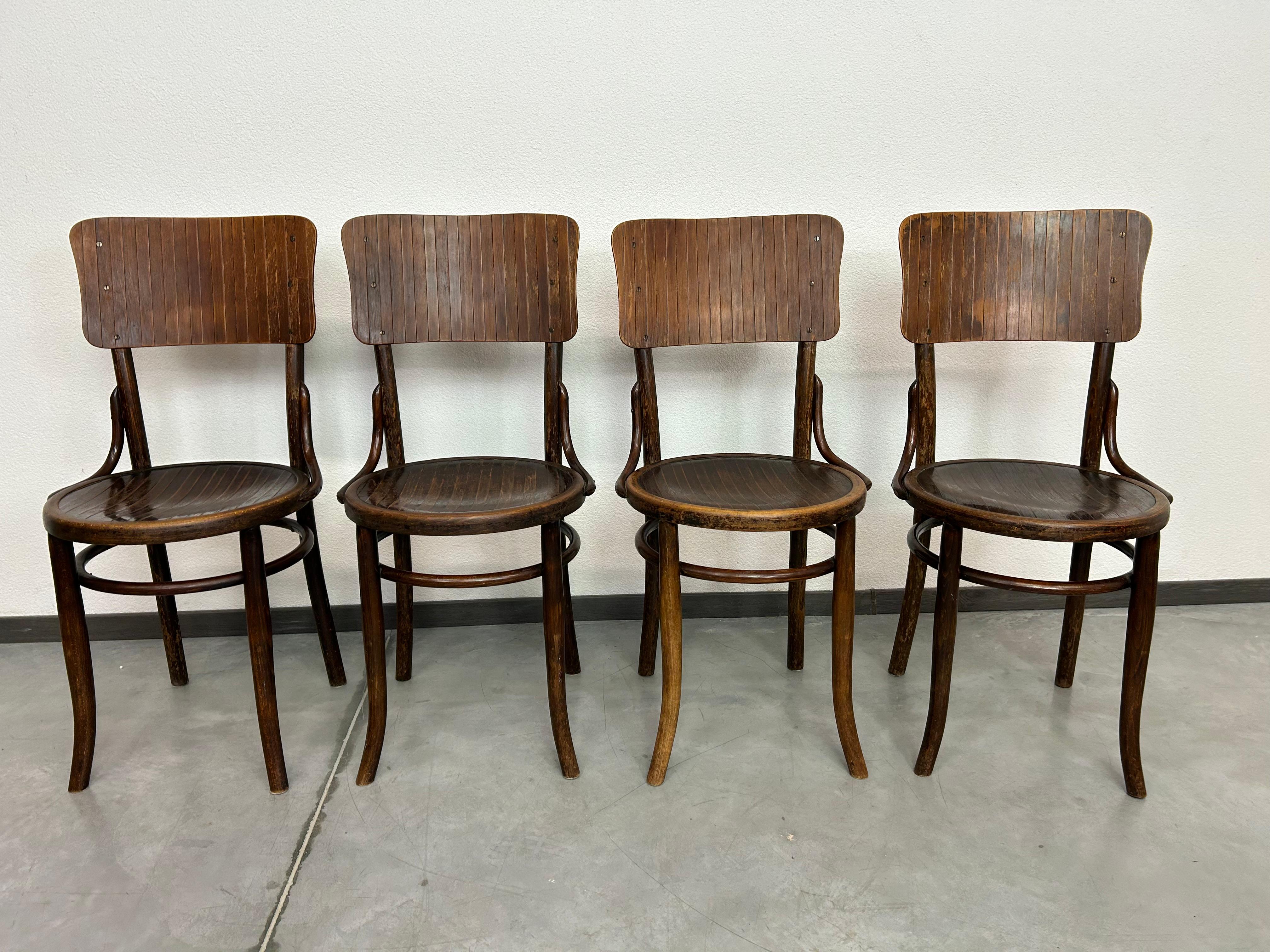 Set of 4 dining room chairs by Thonet Mundus in original vintage condition.