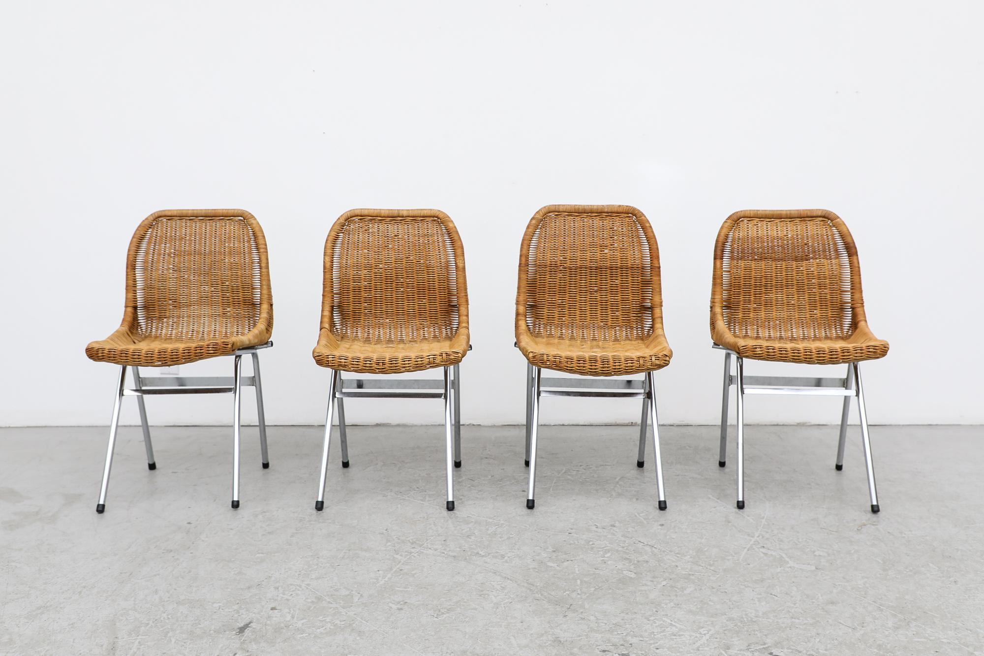 Set of 4 vintage, mid-century rattan chairs by Dutch design master Dirk van Sliedregt, manufactured by Rohe Noordwolde. The chairs have woven rattan shell seats with chrome legs. In original condition with visible wear, including some rattan loss,