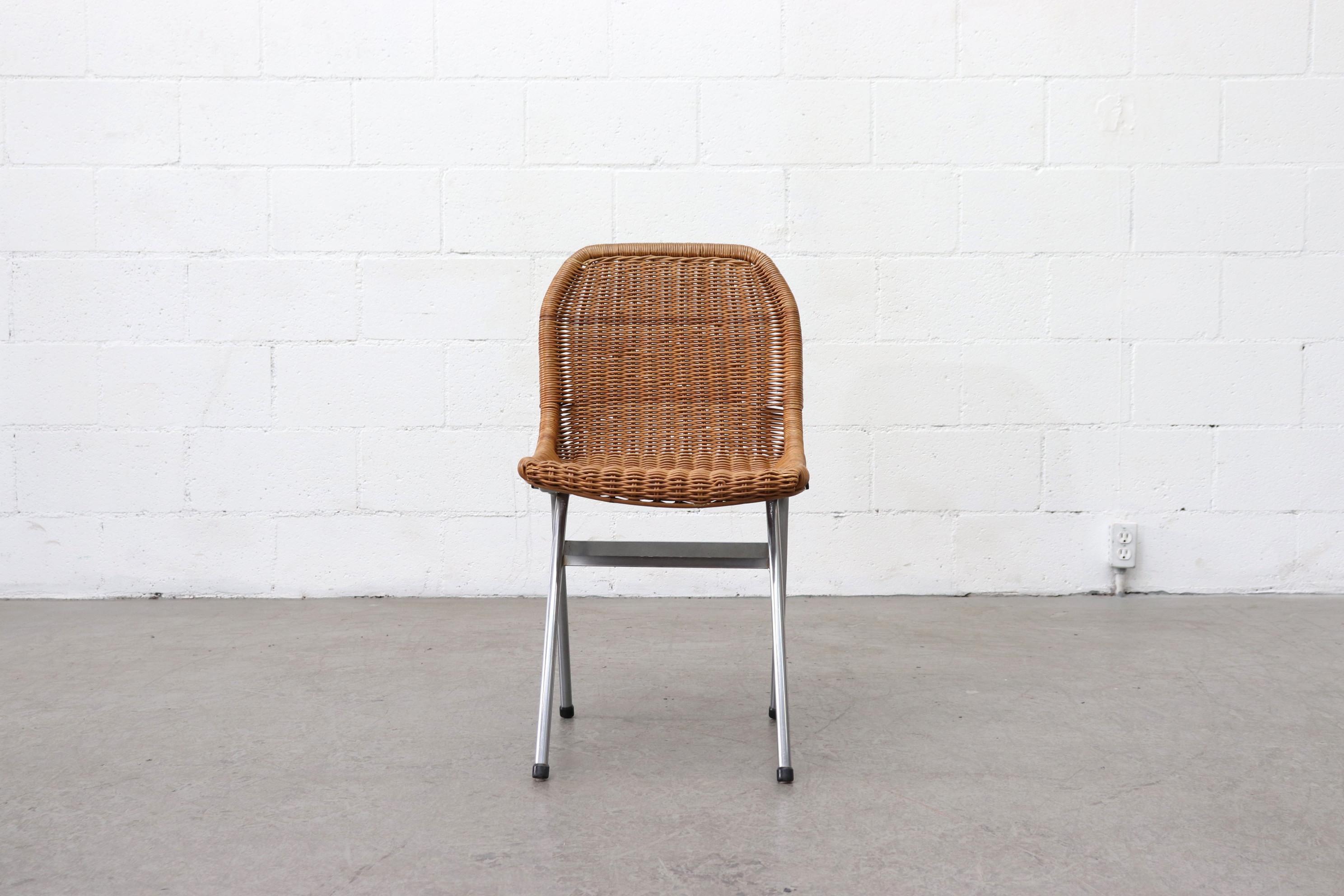 Set of 4 Dirk van Sliedregt rattan woven dining chairs with chrome frames. Original condition, slight imperfections and variations in size and color. Minimal rattan loss, all in original condition. Set price.
 
