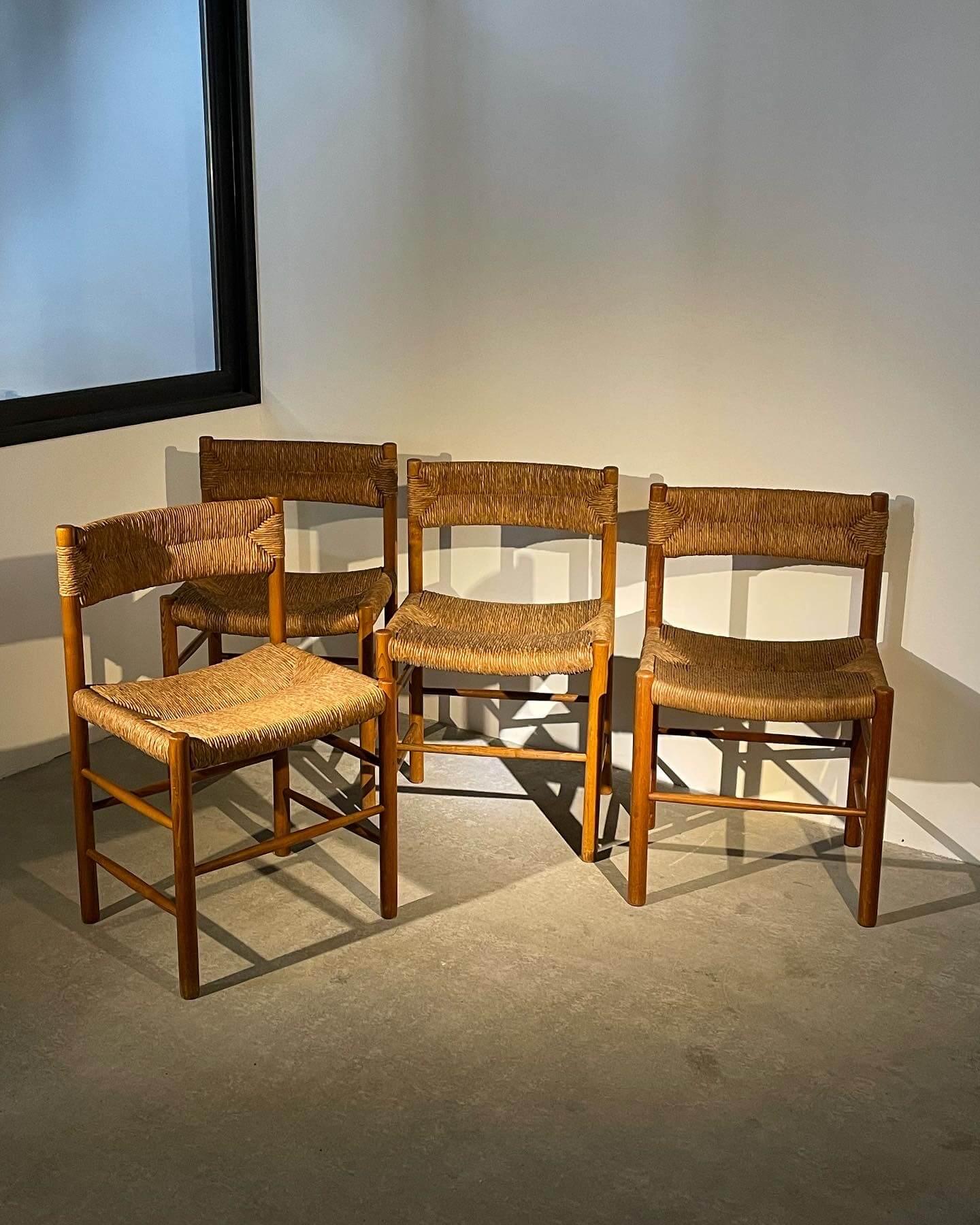Superb set of four French chairs combining simplicity and elegance.

Manufactured in the 1960s by the renowned publisher Robert Sentou in France for Charlotte Perriand, these chairs stand out for their solid ash wood frame and their seat and