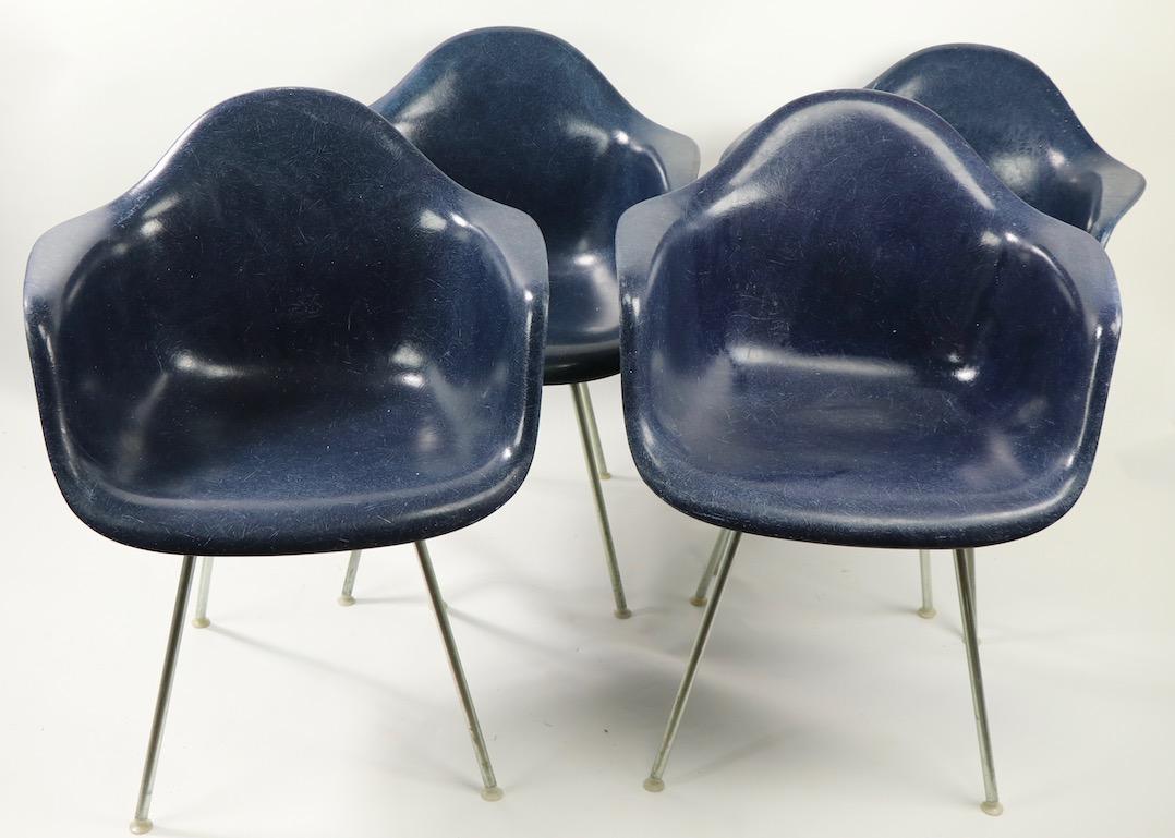 Great original set of 4 Eames for Herman Miller fiberglass bucket chairs, in rare blue color fiberglass. Hard to find sets still intact especially in a less often seen color. The chairs are all original with exception of the screws which are