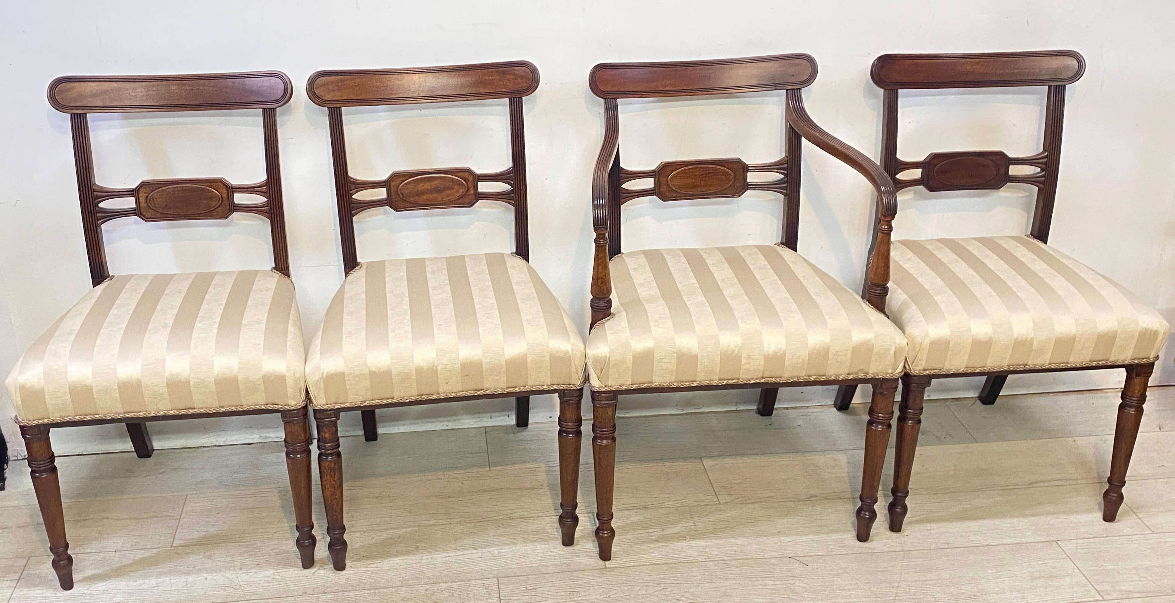 A set of four mahogany Regency style dining chairs, consisting of one armchair and three side chairs with upholstered seats. Recently upholstered.
Quality set of chairs in very good antique condition, comfortable and sound.
England, early 19th