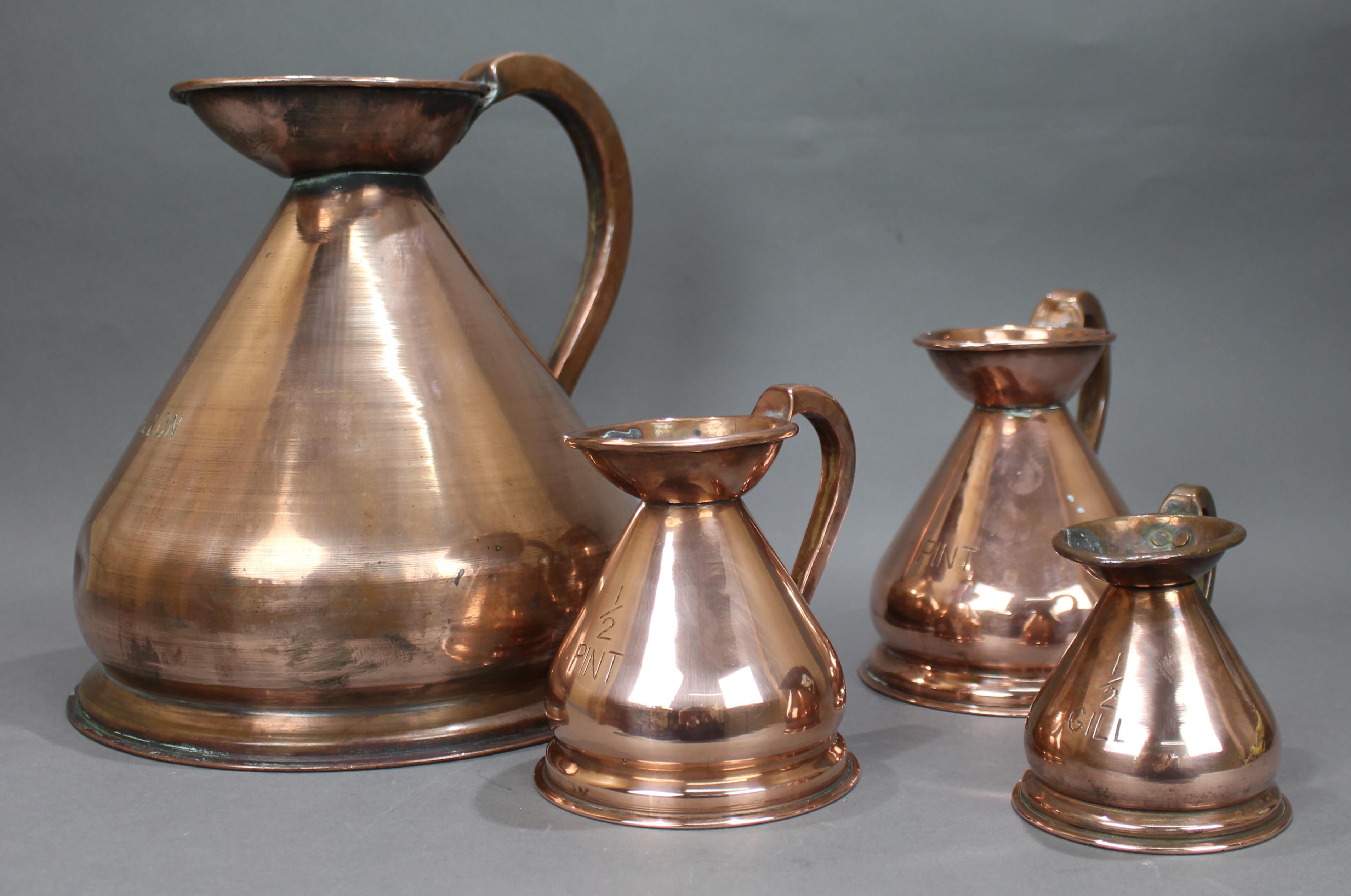 Set of 4 Early Victorian Graduated Copper Measuring jugs


Original antique, early Victorian, English.

Set of 4 Haystack measures; 1 gallon, 1 pint, 1/2 pint & 1/2 gill

Heights from 10 cm to 29 cm.

Makers mark to the top inside