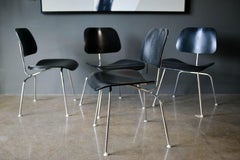 Set of 4 Ebonized Eames DCM Chairs