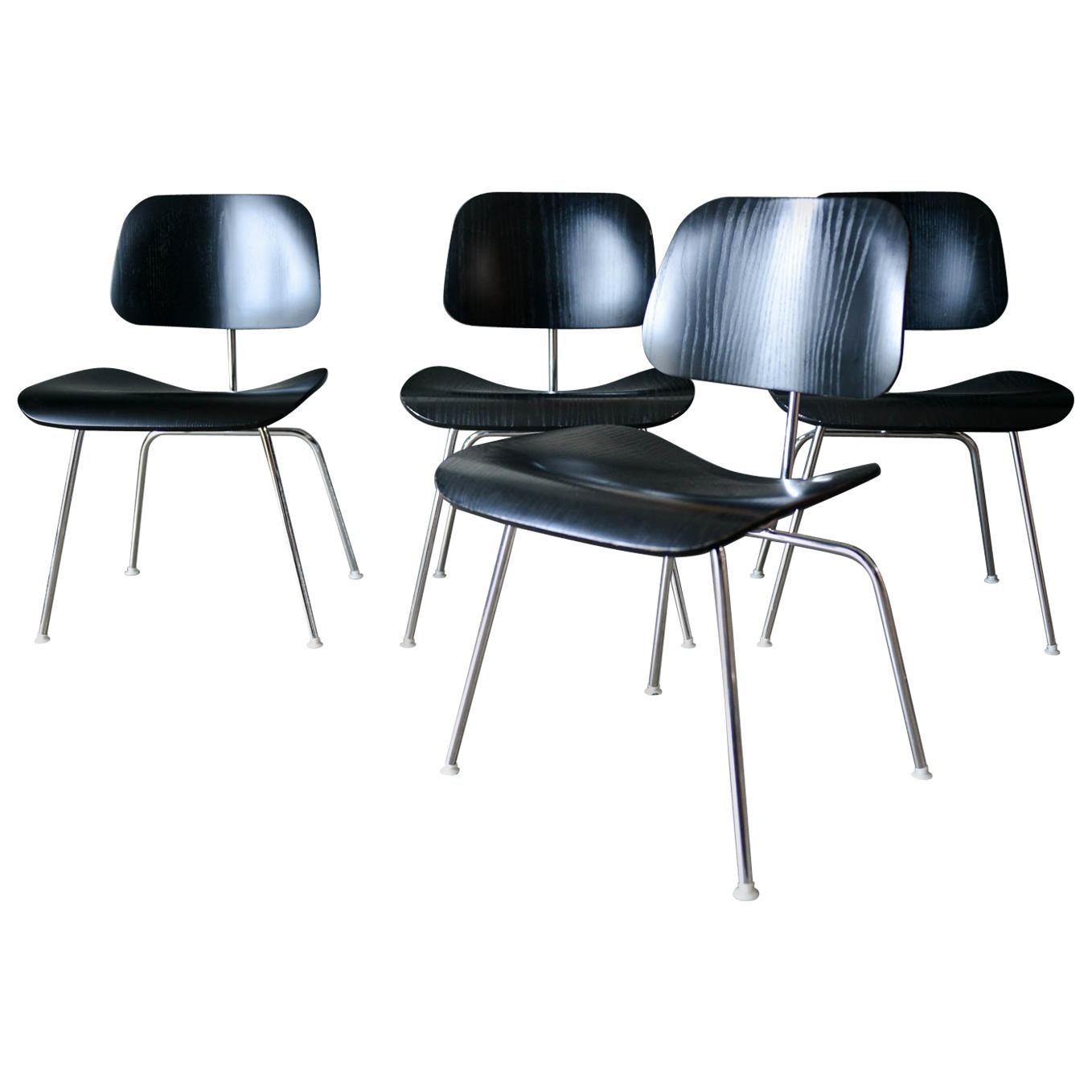 Set of 4 Ebonized Eames DCM Chairs