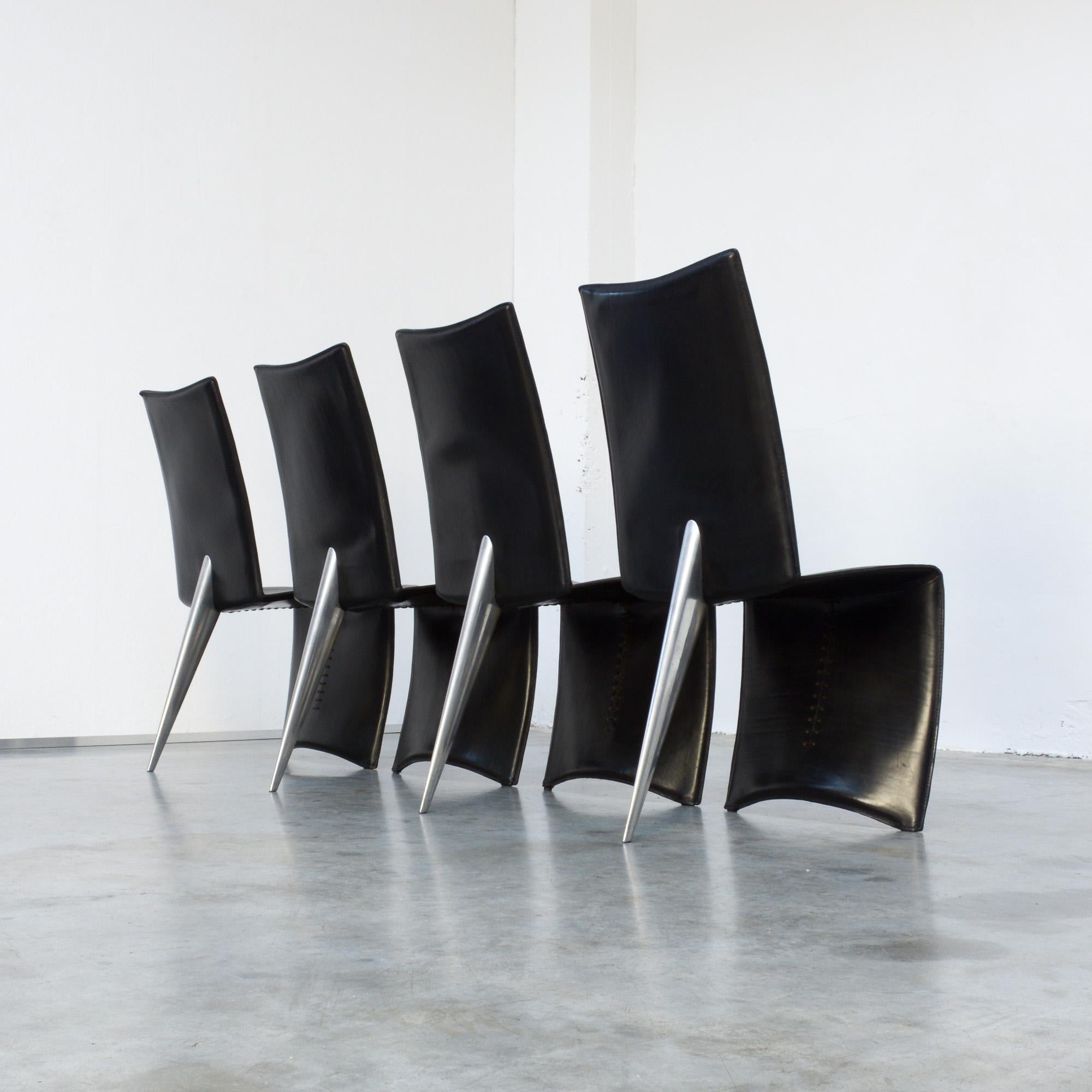 The Ed Archer dining chair was designed by Philippe Starck in 1986 for Driade/ Aleph. The black leather “full dress”, that reaches the floor, strongly opposes to the only polished metal “shark finned” back leg.
It is a strong design executed in