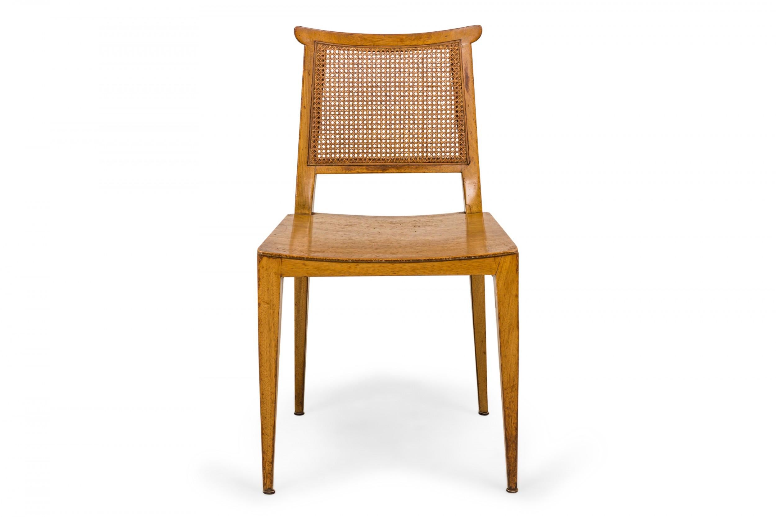SET of 4 American Mid-Century side chairs with light wooden frames, solid wooden seats, and caned backs. (EDWARD WORMLEY FOR DUNBAR FURNITURE COMPANY)(PRICED AS SET)
