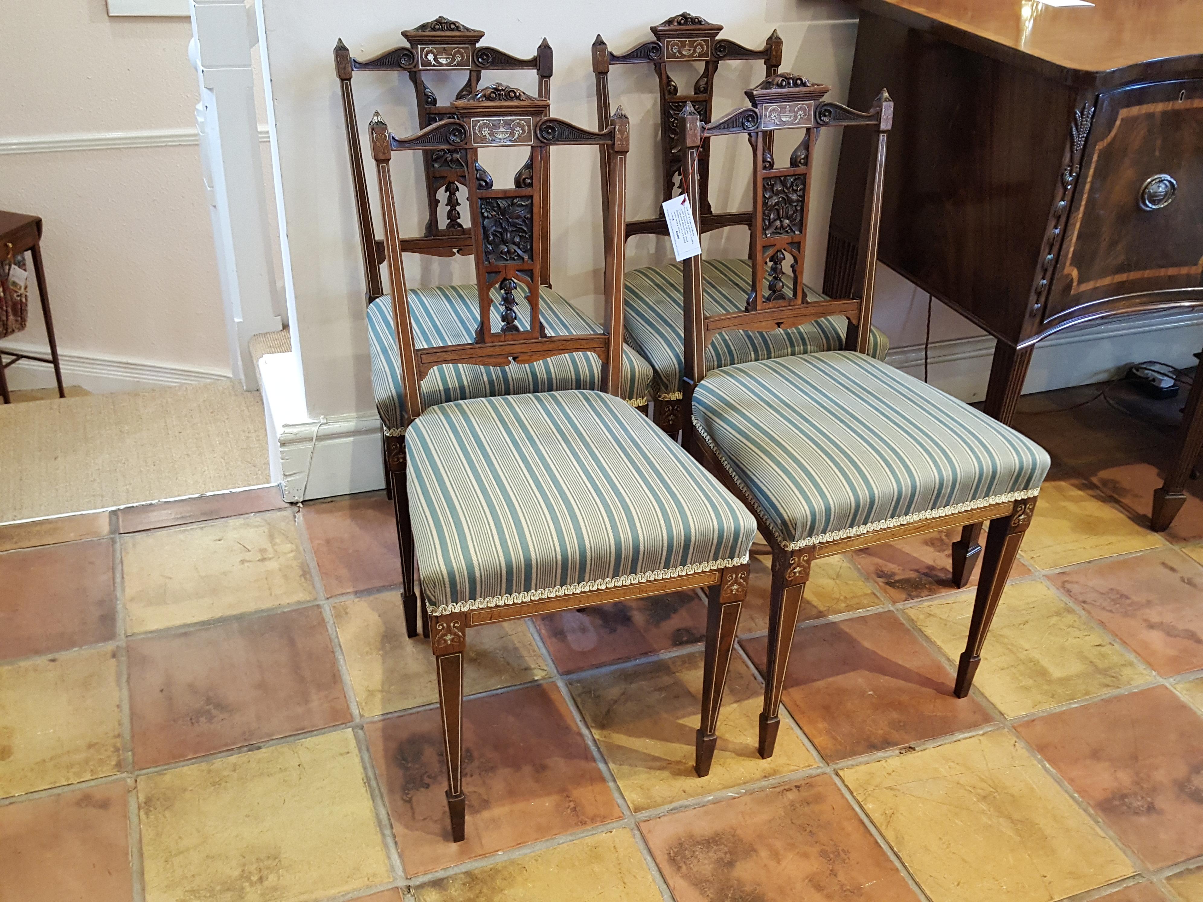 Set of 4 Edwardian rosewood salon chairs with Adam style carved rosettes and bellflowers and Inlaid with ivory urns
Measures: 18