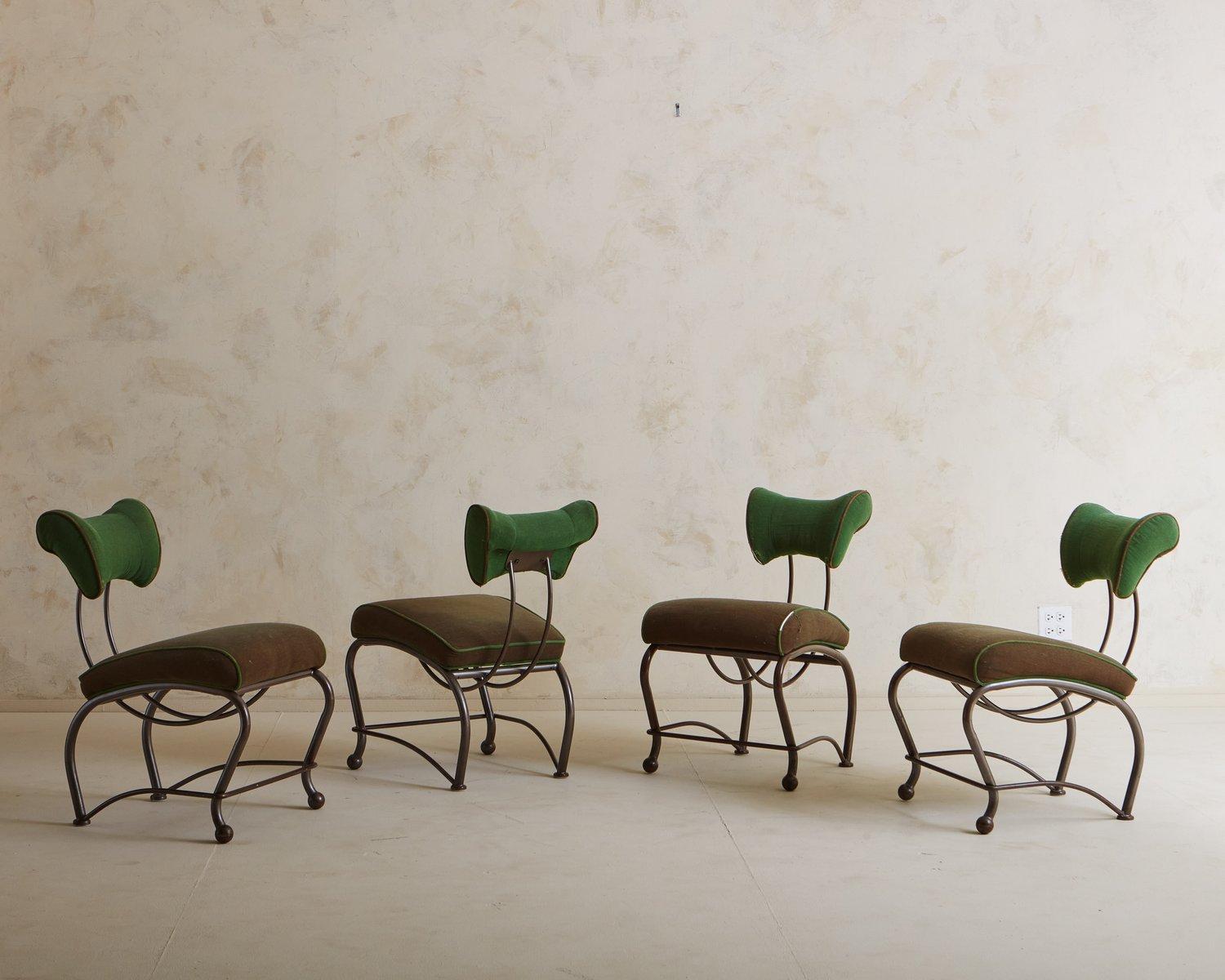 A set of 4 Elbert chairs designed by Jordan Mozer in the 1990s and manufactured by Shelby Williams Industries. These unique chairs have sculptural steel frames with curved, upholstered seats and backs in brown and green fabric with contrasting welt
