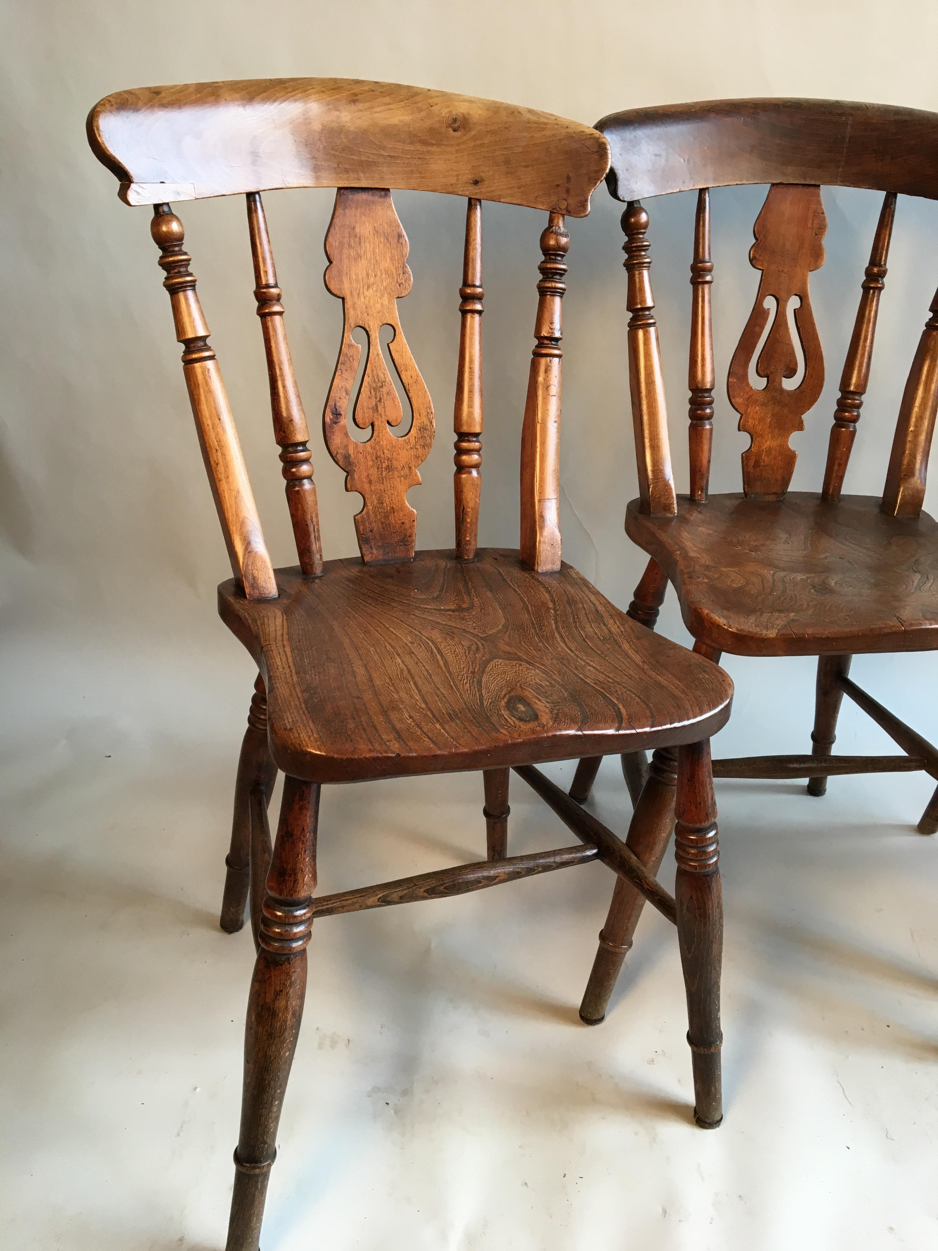 Set of 4 slat-back country chairs in elm with turned legs and wood seat, circa 1850, English.