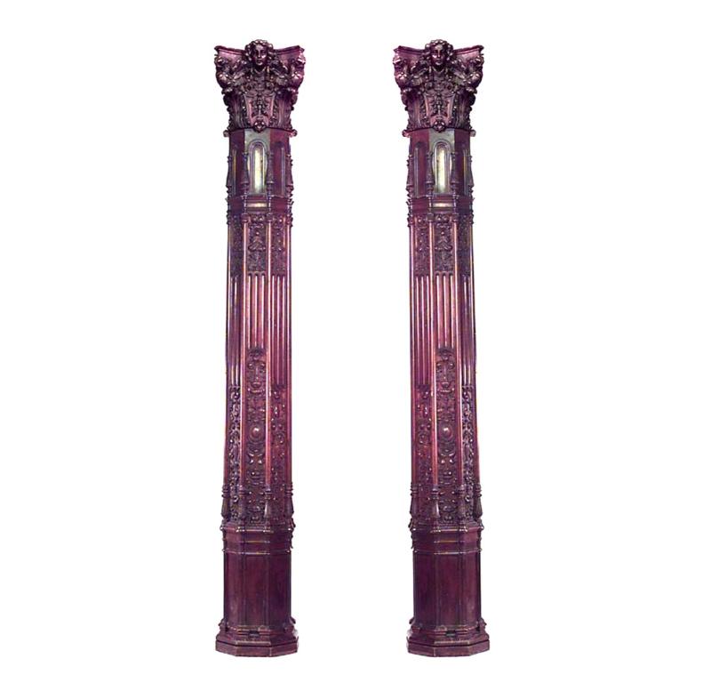 Set of 4 English Gothic Revival style (19th Century) carved mahogany octagonal columns with cupid heads on capitals.