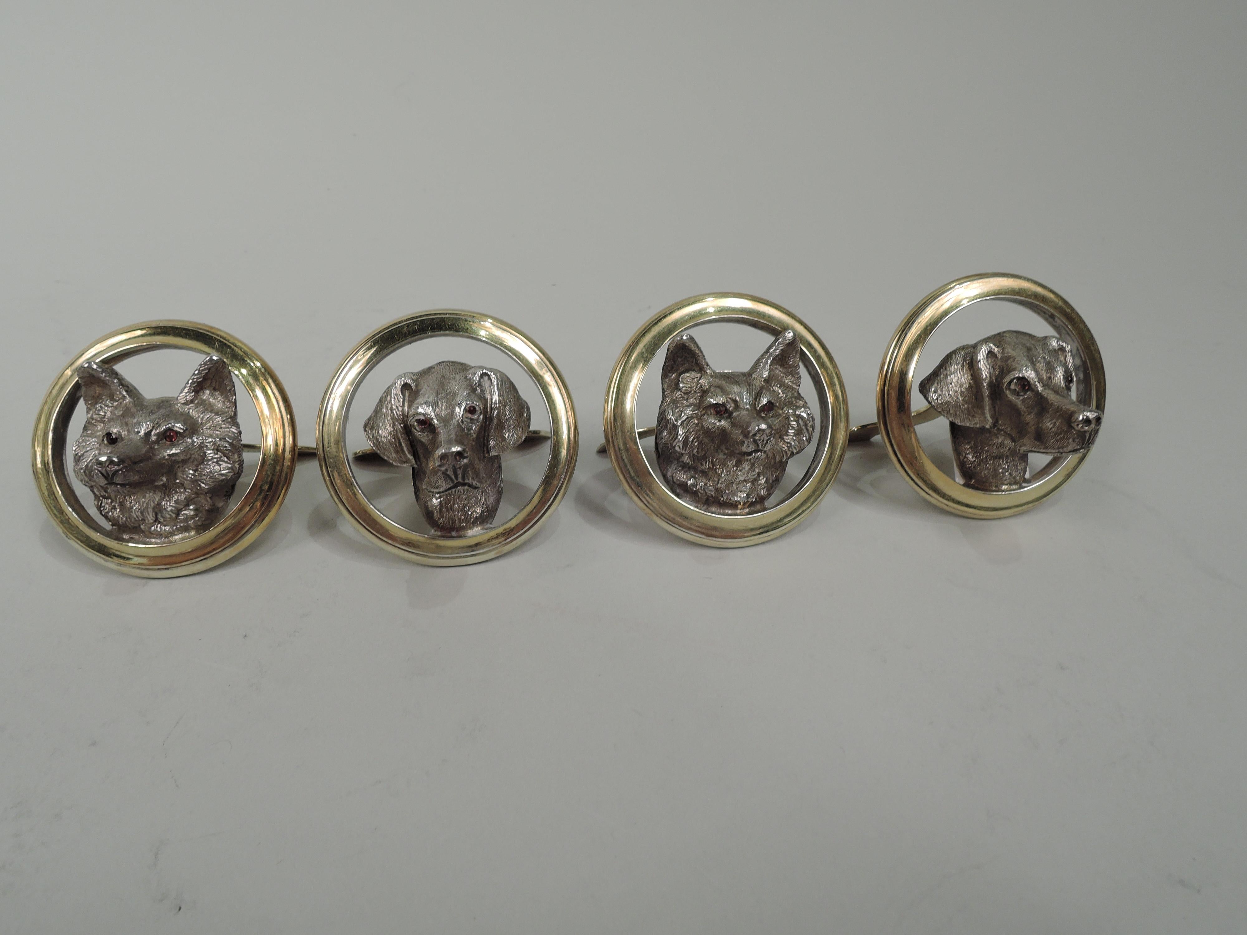 Set of 4 George V sterling silver place card holders. Made by Goldsmiths & Silversmiths in London in 1911. Each: Round gilt ring inset with cast animal head. Two holders have fox heads and two have hound heads. Prey and predator have long pointed