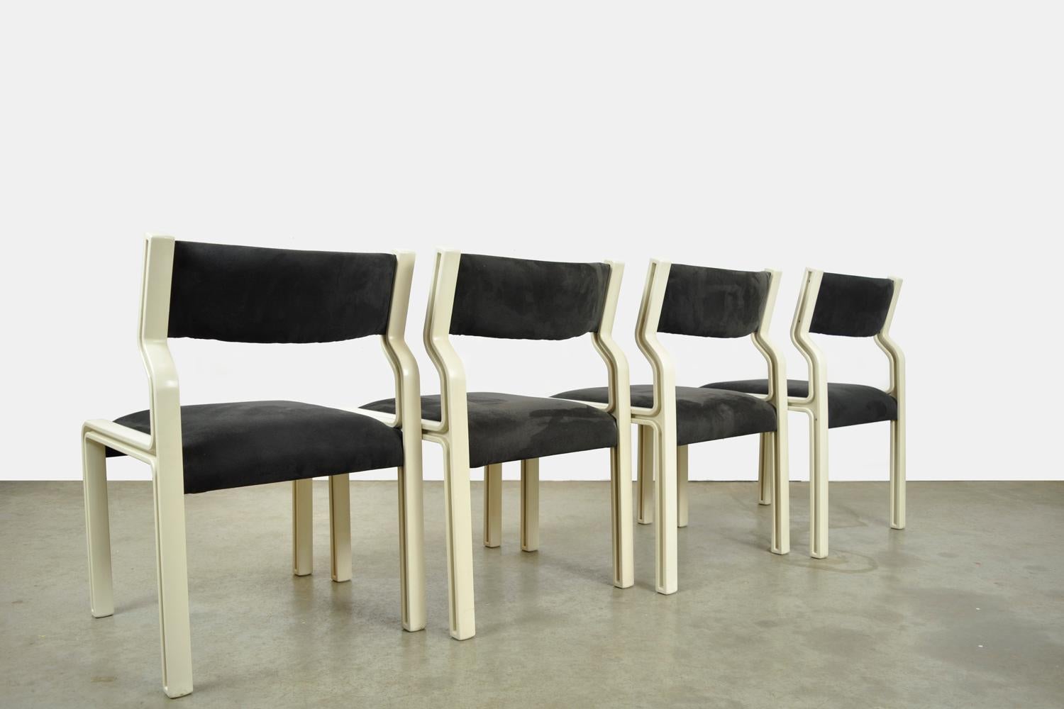 set of four dining room chairs designed by Pierre Mennen for Pastoe, 1972 Netherlands. The chairs, model SP3005, have an experimental frame of molded off-white PVC, a seat and back of thermoformed wood, covered with black Alcantara (not original).