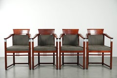 Set of 4 fabric dining chairs with armrests in good condition