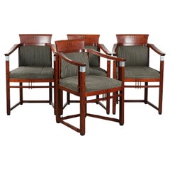 Set of 4 fabric dining chairs with armrests in good condition