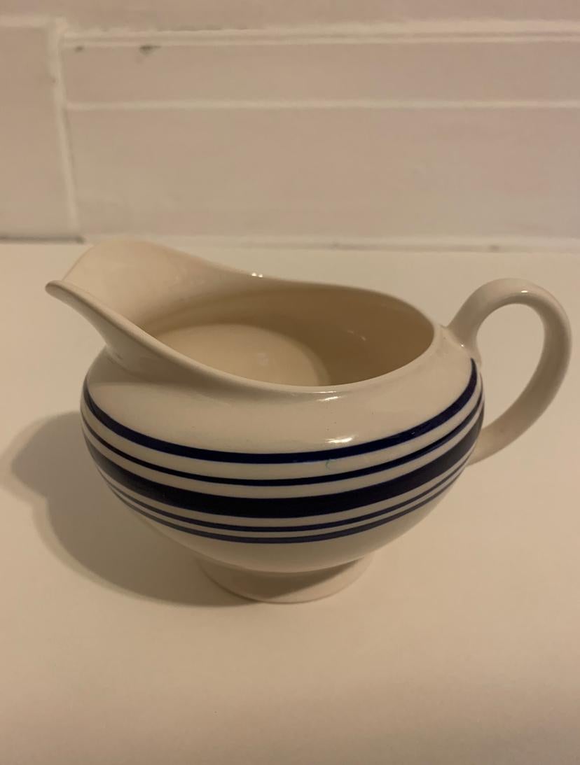 A lot of 5 (five) pieces in the farmstead ticking blue and white stripe pattern by Ralph Lauren Home collection. China. Signed. Imported, production period early 1990s.

Features a hand painted blue and white ticking-inspired striped border on