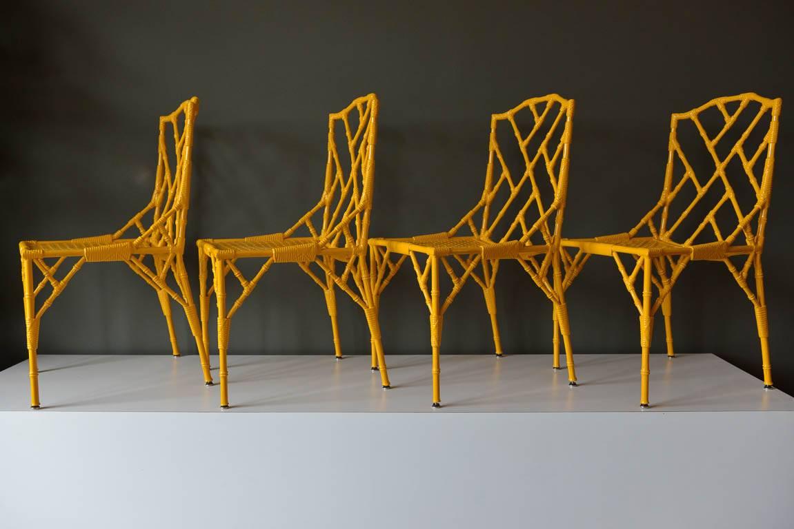 Set of 4 Bombay faux bamboo metal chairs by Venemen of California, ca. 1960. Professionally restored and powder coated in whimsical yellow/gold.  Self adjusting feet.


Chairs measure 18