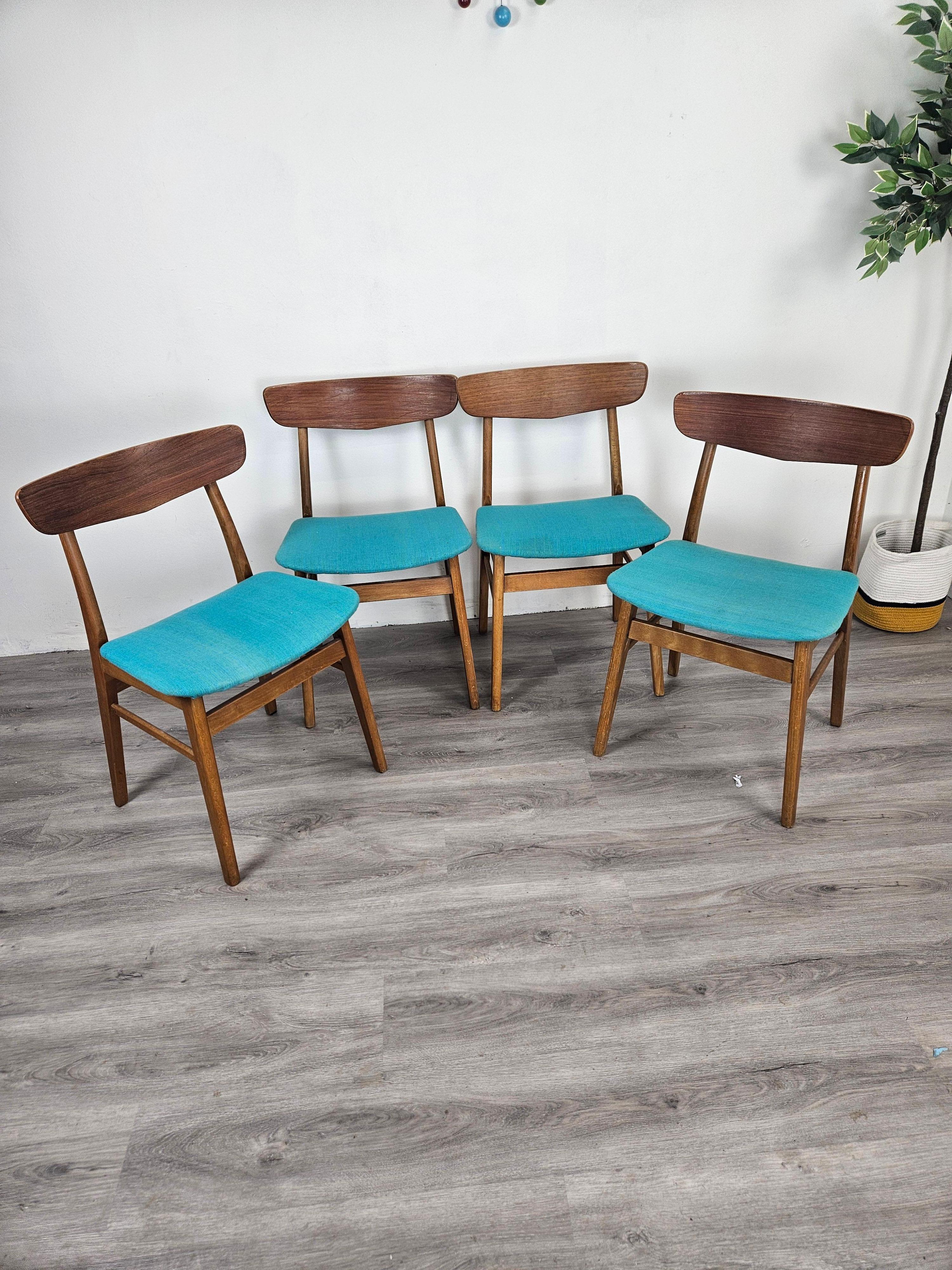 This set is four Danish dining chairs were produced by Findahls Mobelfabrik in the 1950s and 60s. This set has a beech frame and teak backrests with fabric seat covers in colorful teal. The contrast of the teak back and teal fabric is striking.
The