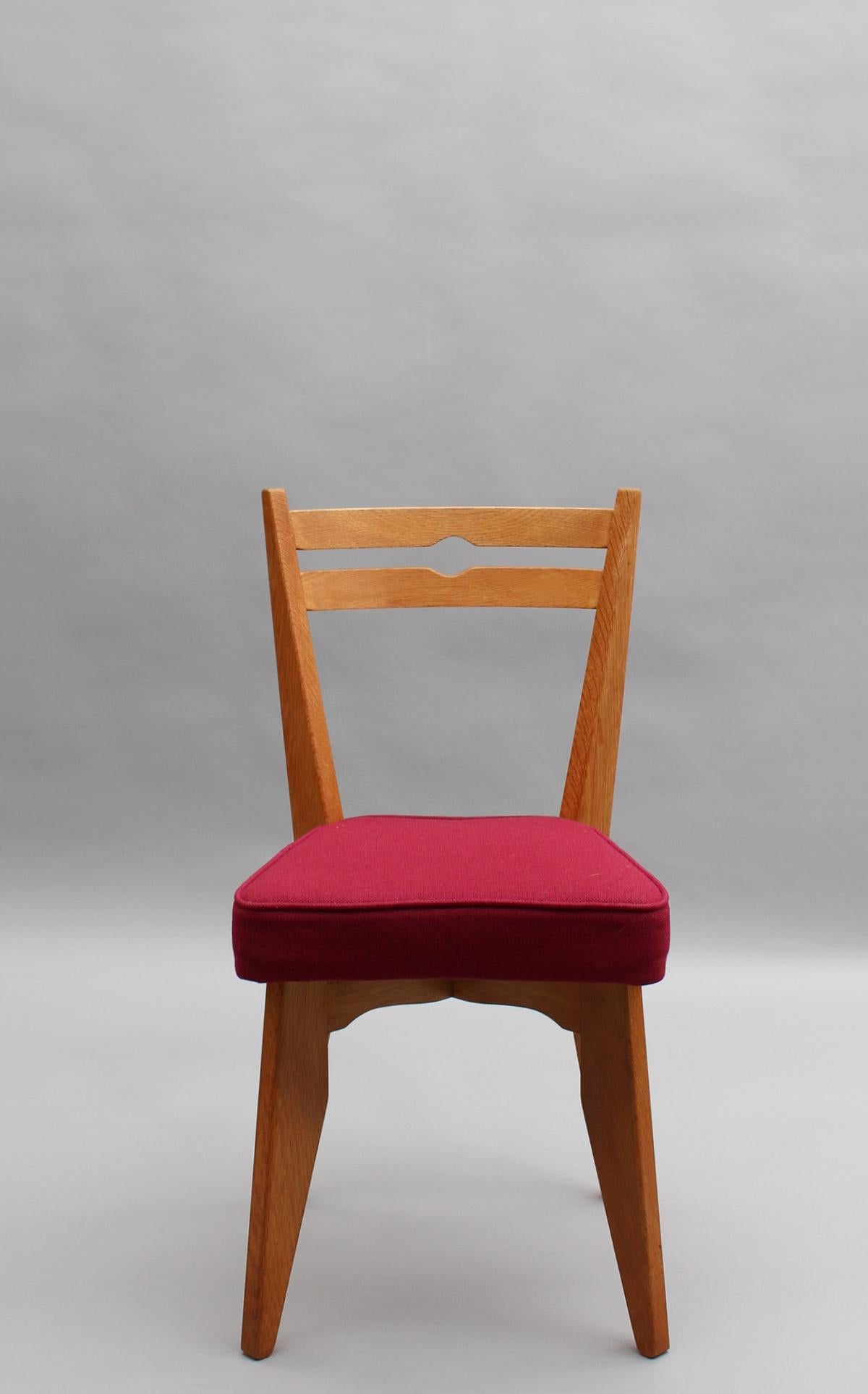 Mid-Century Modern Ensemble de 4 chaises de salle à manger en Oak des années 1950 de Guillerme et Chambron en vente