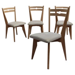 Ensemble de 4 chaises de salle à manger en Oak des années 1950 de Guillerme et Chambron
