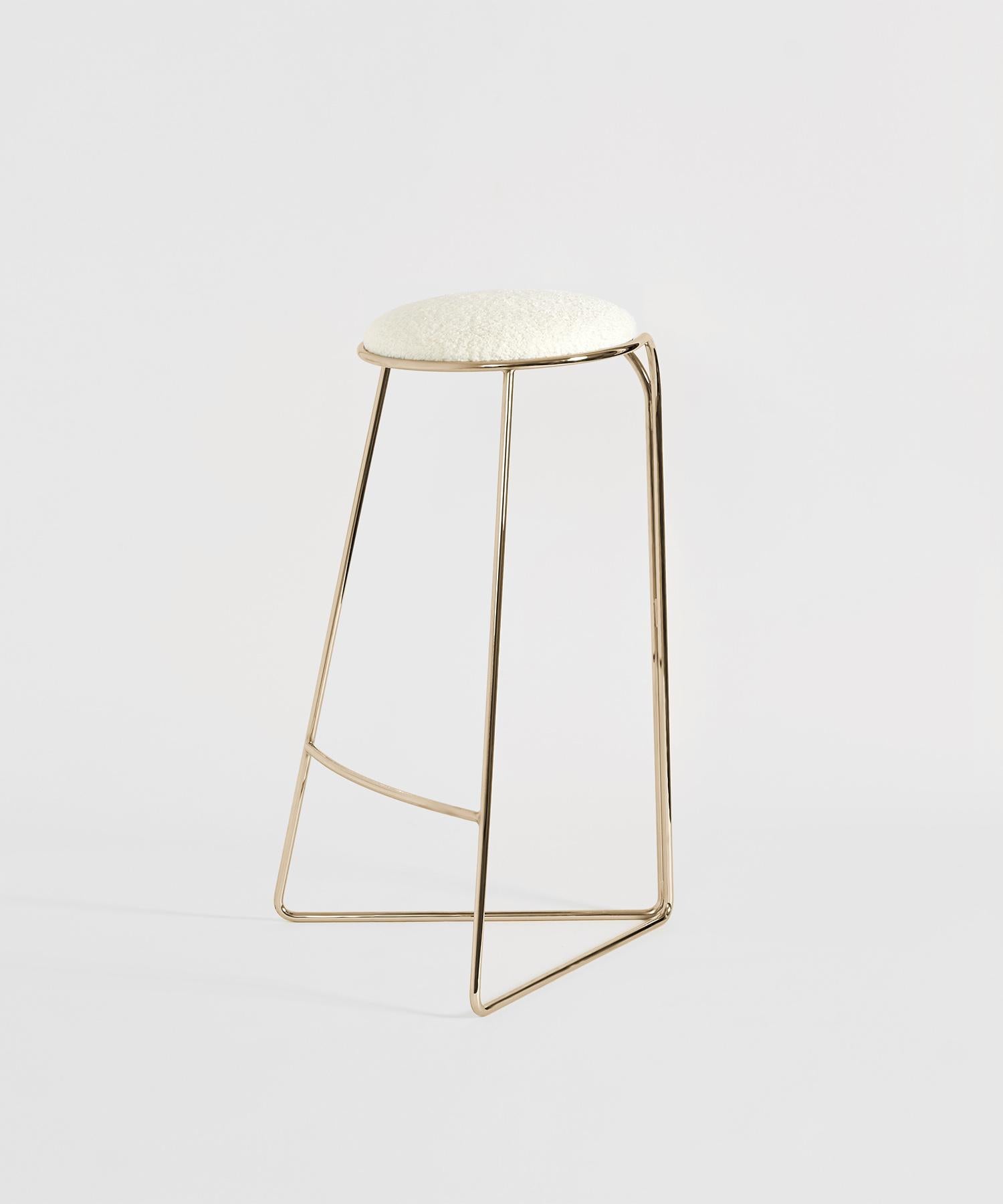 Flow Gold is the epitome of elegance and innovation—a creation that transcends the ordinary bar and counter stool to become a functional work of art, elevating any space with a touch of timeless luxury. Designed by Enrico Girotti, this iconic piece