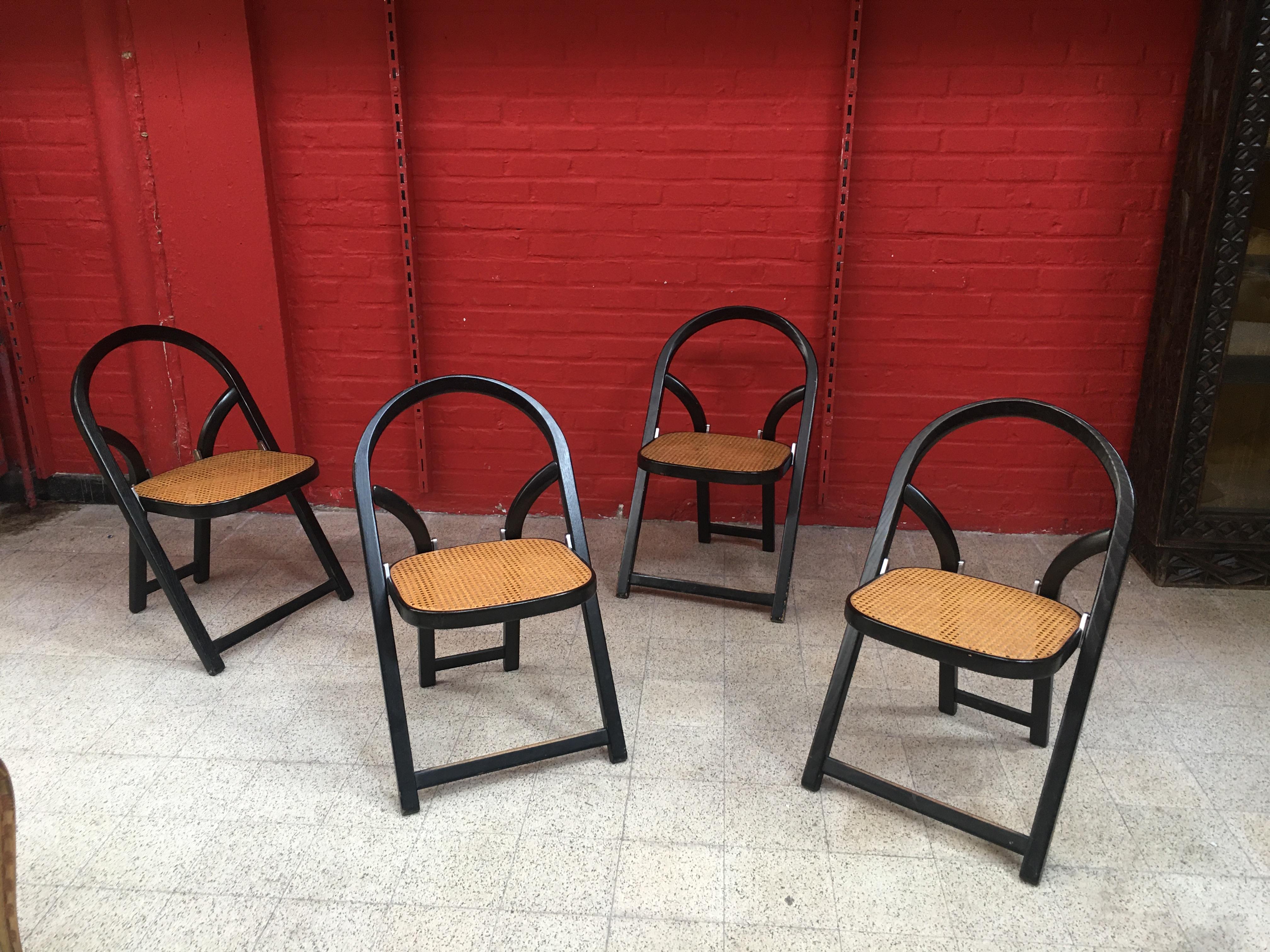  4 folding chairs in solid ash.
Chromed folding mechanism. Cane in good condition.
Arca by Gigi Sabadin created in 1974 for Crassevig.

Measures: Seat height 44cm
Total height 79cm
Depth / Length 49cm
Width 49cm
Folded thickness 7cm.